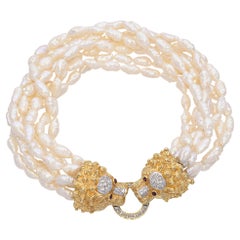 Pulsera vintage de perlas de Cardow con diamantes de oro amarillo de 14 quilates  Cierre de cabeza de león