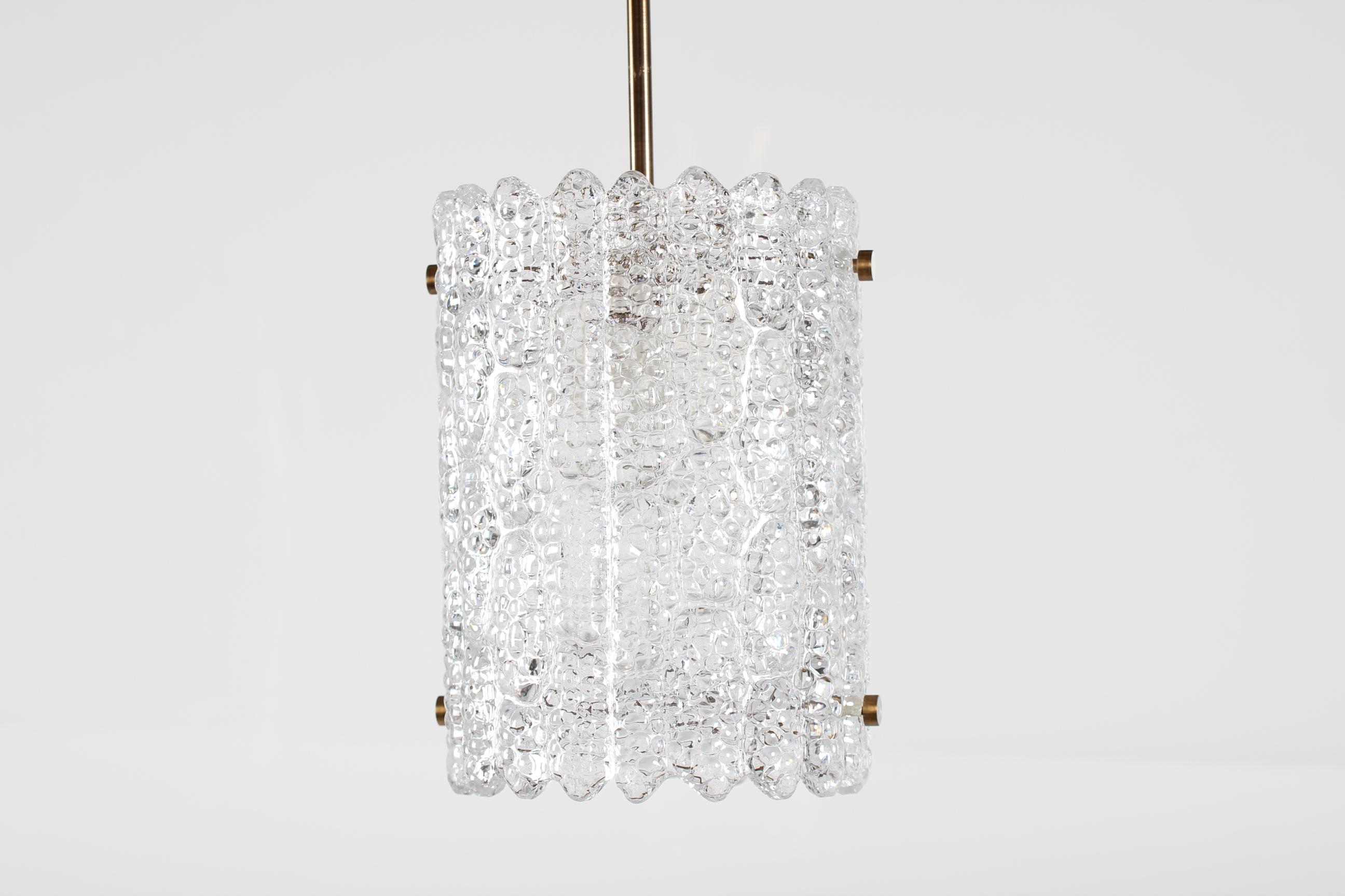 This pendant lamp by Swedish designer Carl Fagerlund for Orrefors was produced in the 1960s. The piece is made of heavy crystal glass and brass. The lamp requires an E27 bulb with a maximum of 60 W and remains fully functional.

Measures: Height