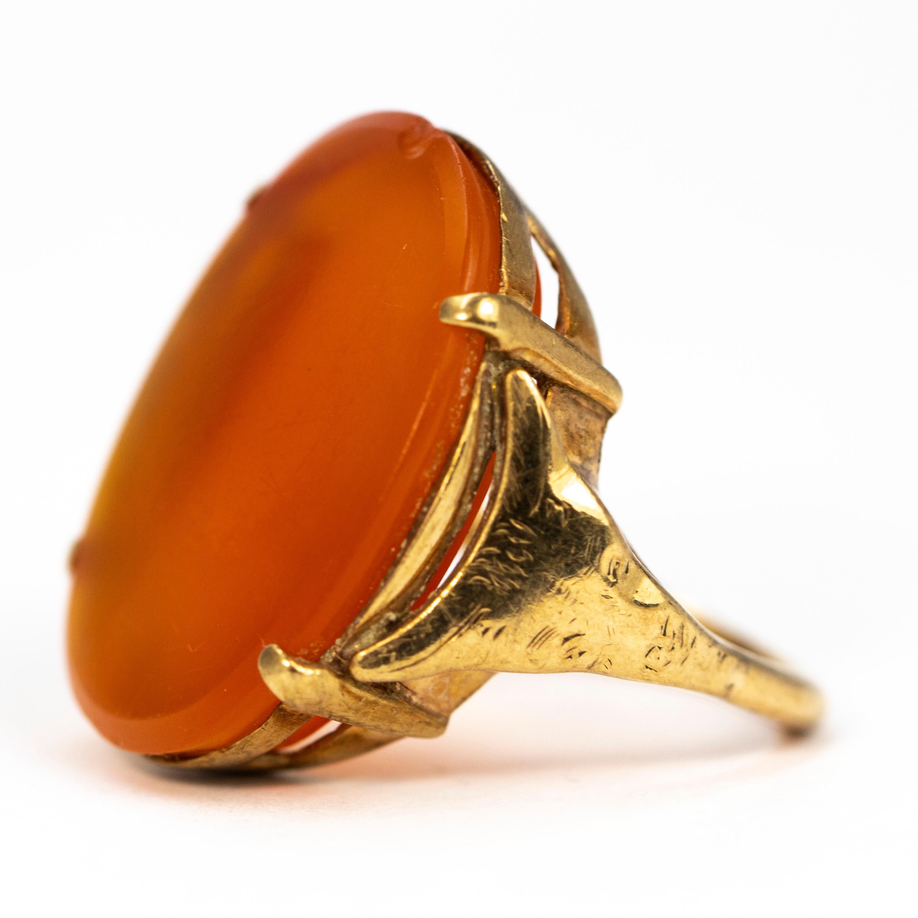 The giant carnelian stone in this ring is gorgeous, glossy and a pretty deep orange colour. The size of the stone is sure to grab some attention! It is held within four delicate claws which let the stone really speak for itself!

Ring Size: M 1/2 or