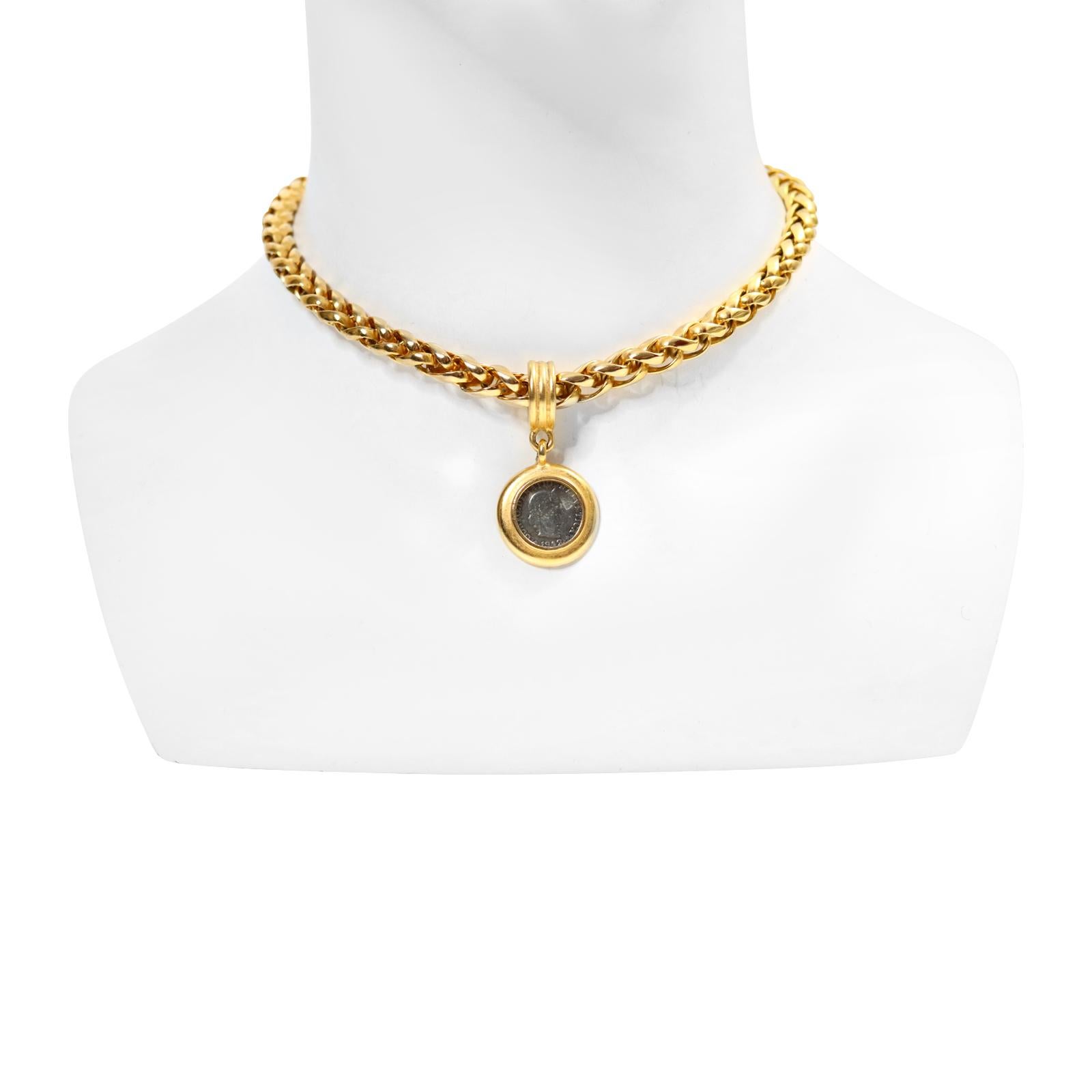 Vintage Carolee Gold Chain and Dangling Coin Necklace Circa 1990s. This is a heavy and well made braided chain with a silver tone coin encased in the gold tone which looks great with the offset different metals.   This is a classic necklace that is
