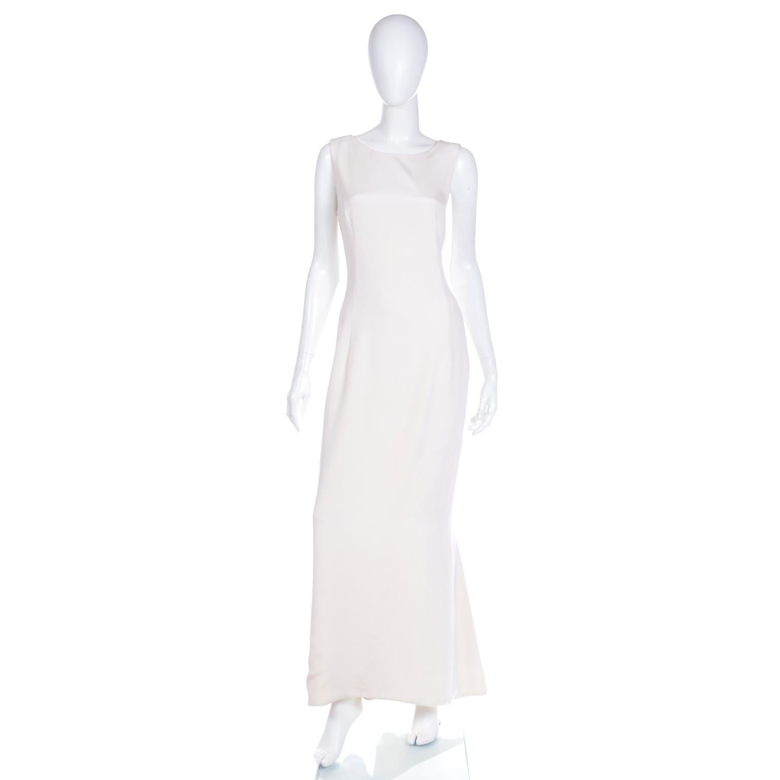 This exquisite evening gown is a testament to Carolina Herrera's timeless elegance. This lovely ivory silk crepe evening dress is ultra refined and sophisticated. The flattering silhouette is a loose mermaid style with a flared, more fluid lower