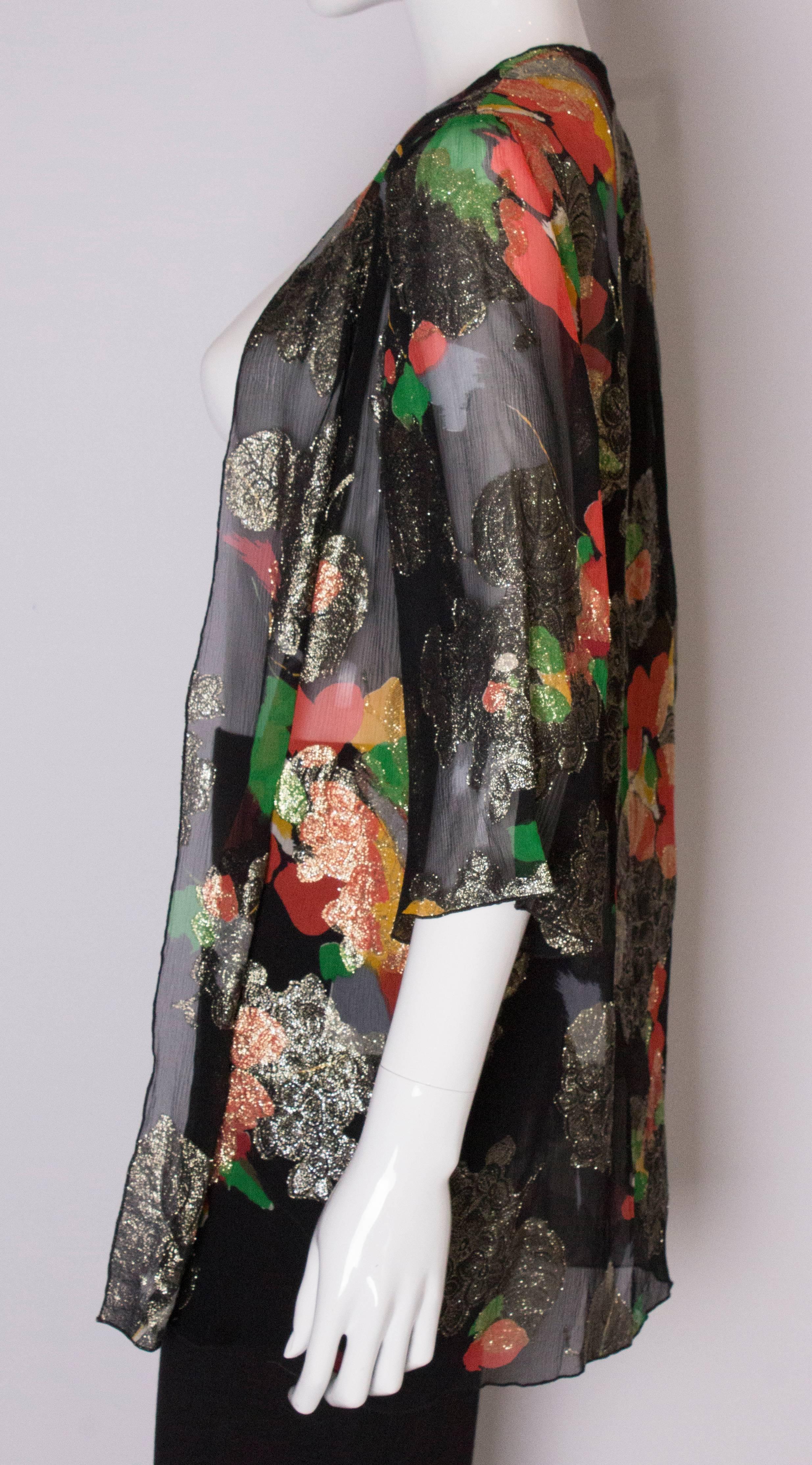 A Vintage 1980s lurex floral evening jacket by Caroline Charles  1