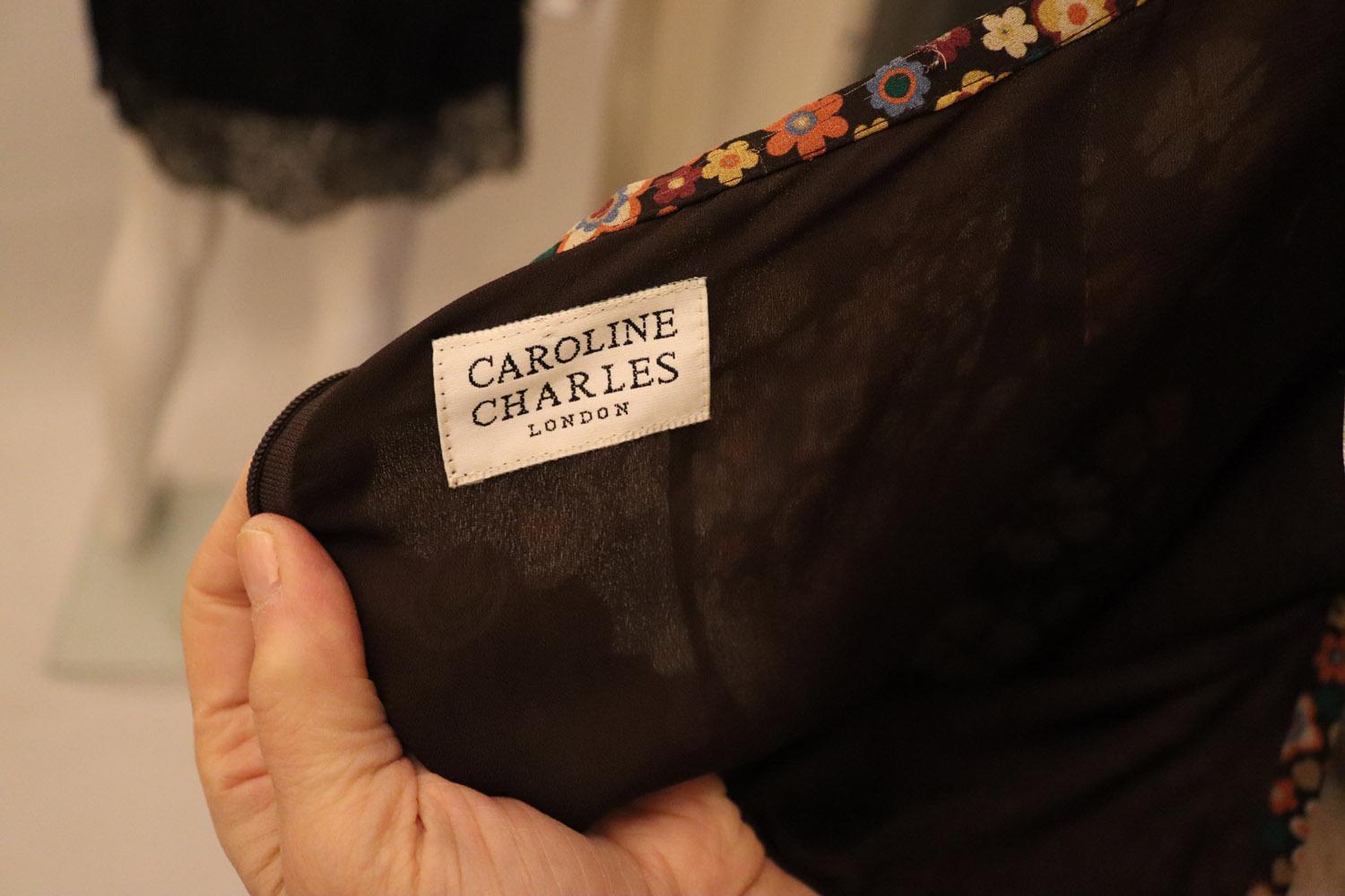 A fun vintage silk skirt by Caroline Charles. In a mix of floral prints in attractive vertical panels, the skirt moves nicely when you walk. It has a back zip  opening and is lined.
Size UK 12 . Measurements Waist 28'', length 34''