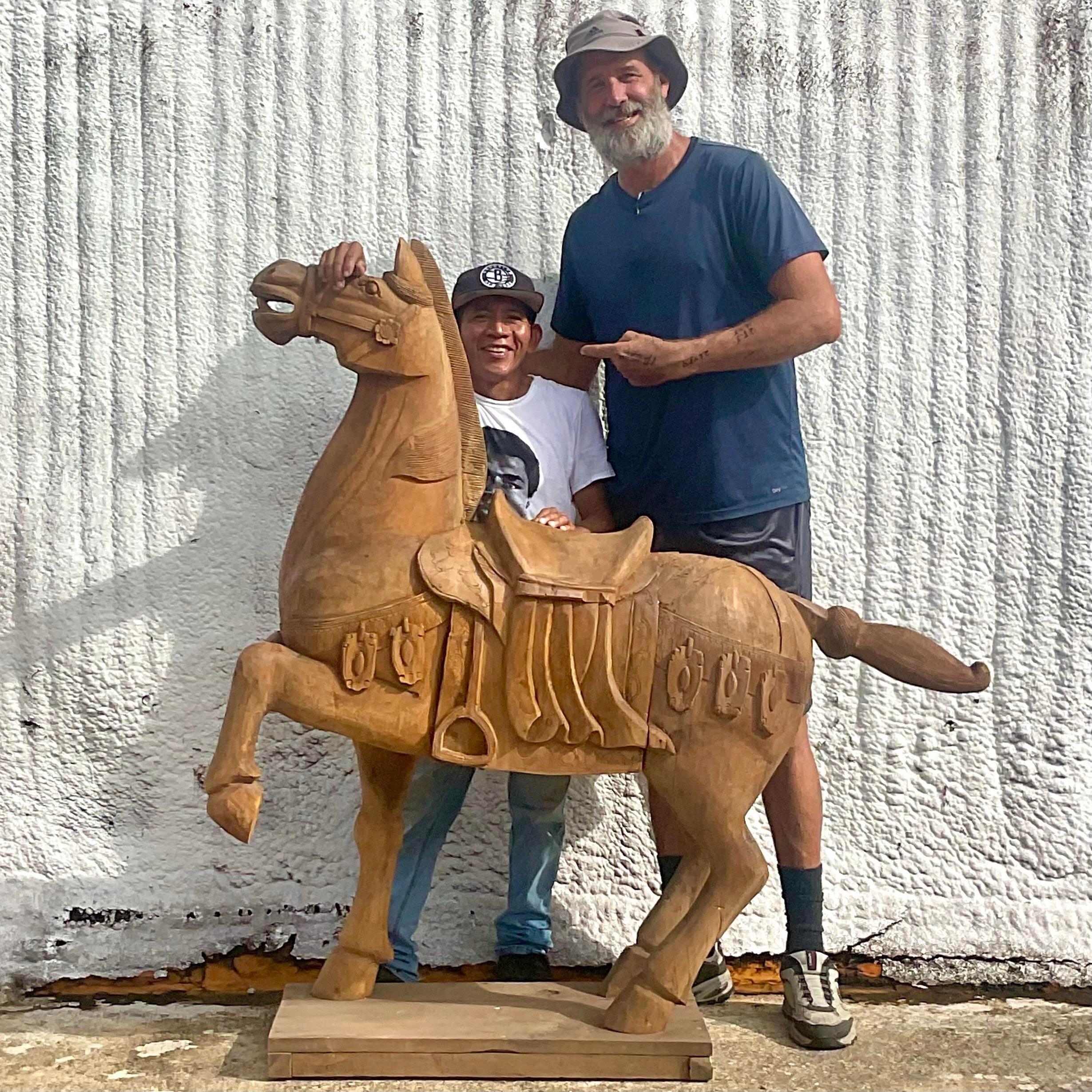 An absolutely incredible vintage Boho horse. Monumental in size and drama. Beautiful hand carved detail and gorgeous wood grain. Acquired from a Palm Beach estate.