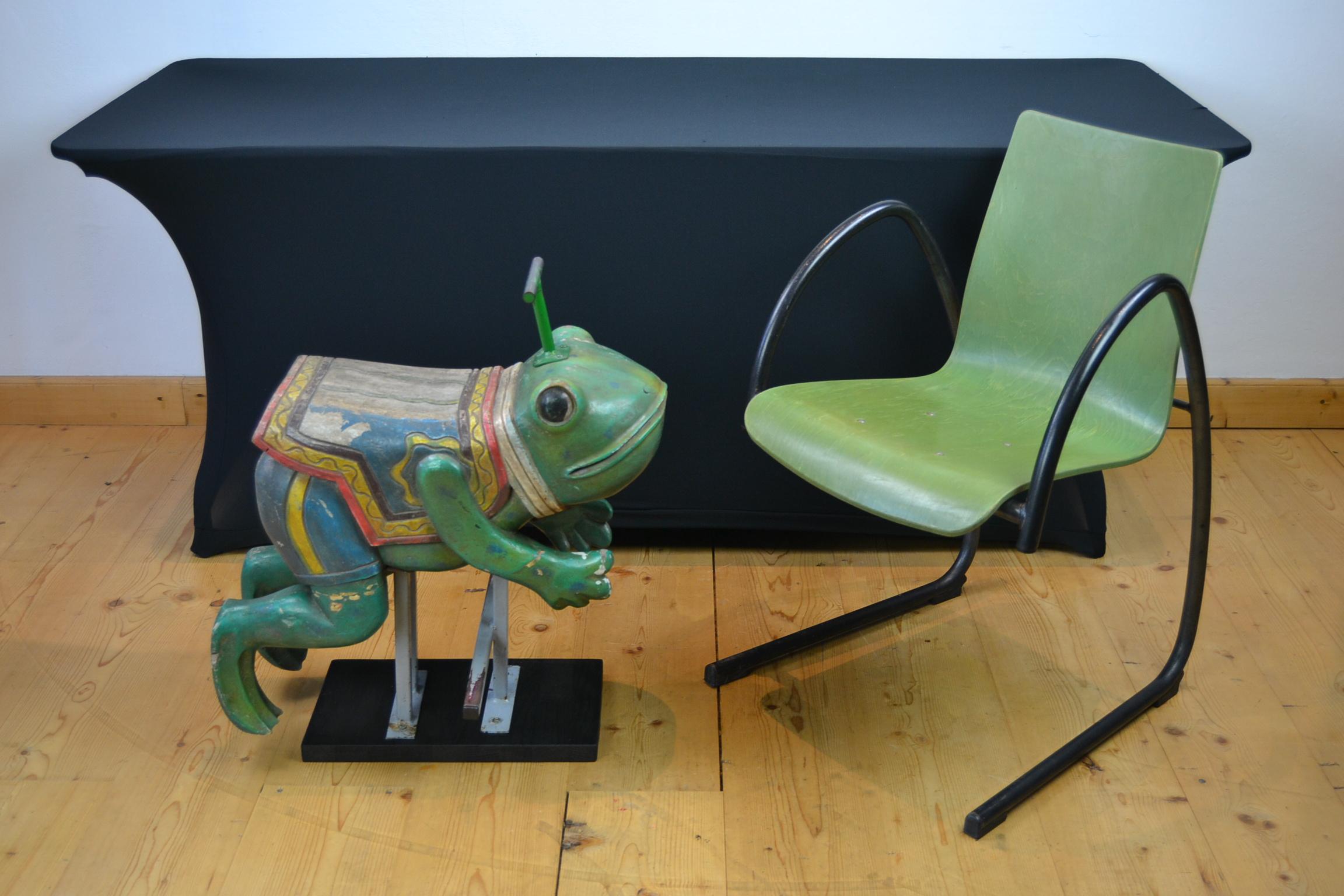 Vintage carousel frog sculpture. 
Who doesn't fall in love with this cute small animal children's fairground seat.
This frog seat was used on the Merry-go-round and dates circa 1970 - 1980. 
It's a full wooden jumping frog animal on two iron
