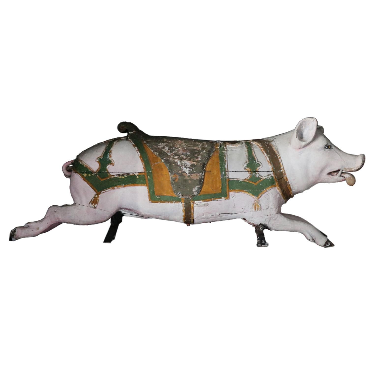 A vintage wooden pig that was once part of a carousel.