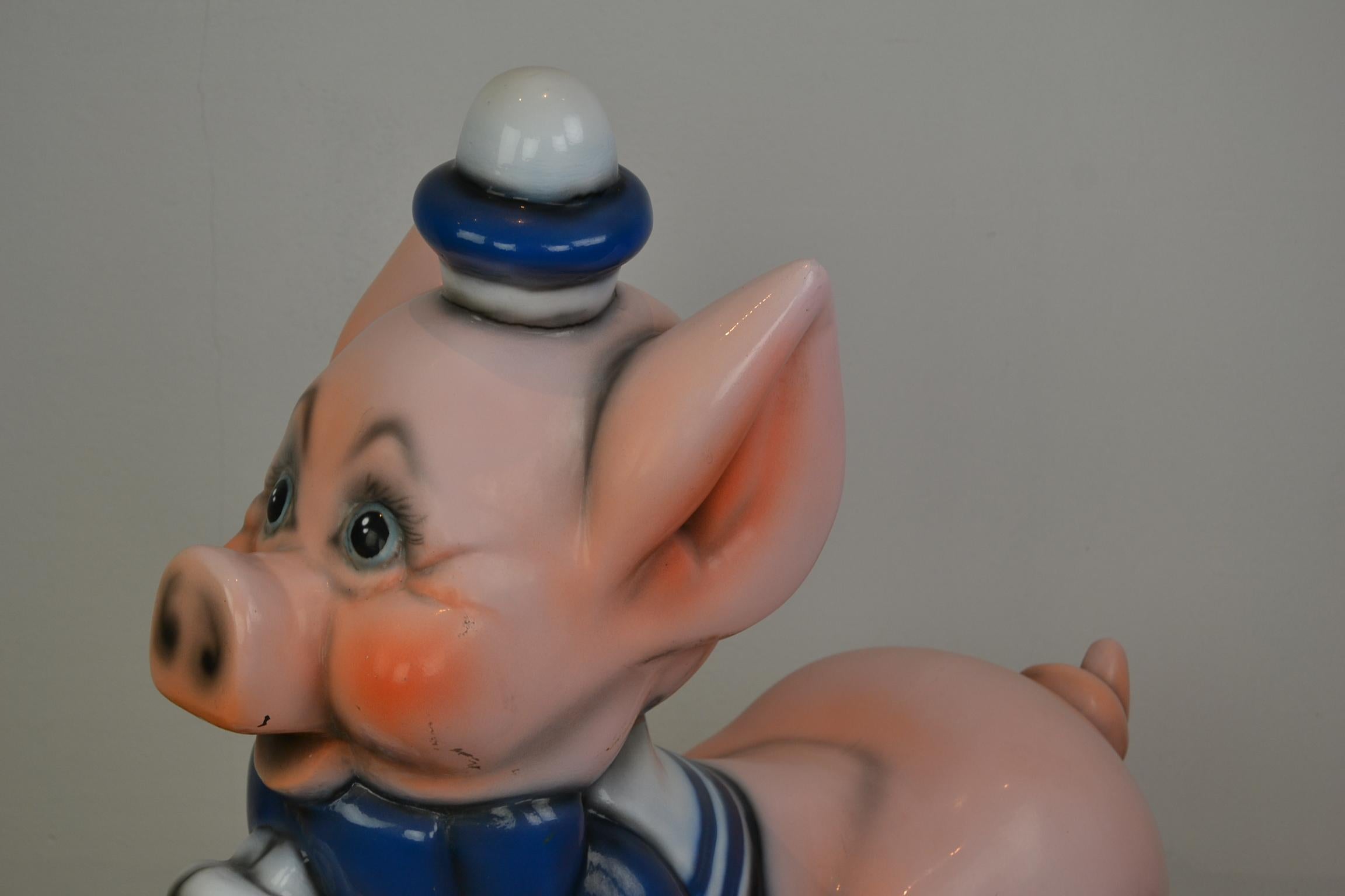 Vintage carousel ride pig. This Carnival ride pig is made of fiberglass and stands on an iron base. This cute animal ride does make us thinking at porky pig or the 3 little pigs.
It's a great decorative object for your interior or business and also