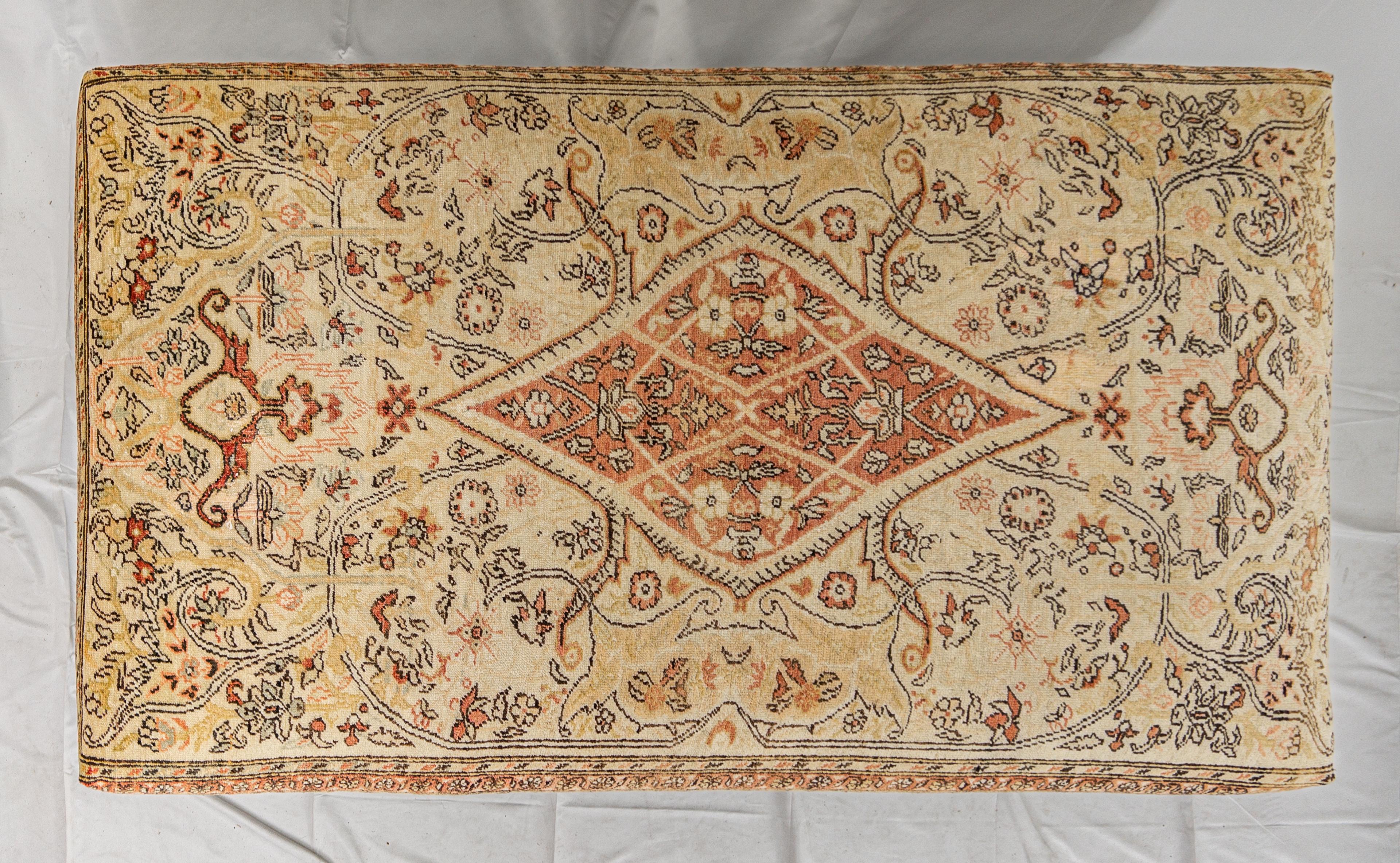 Vintage Carpet Ottoman. Large rectangular shape with turned legs.