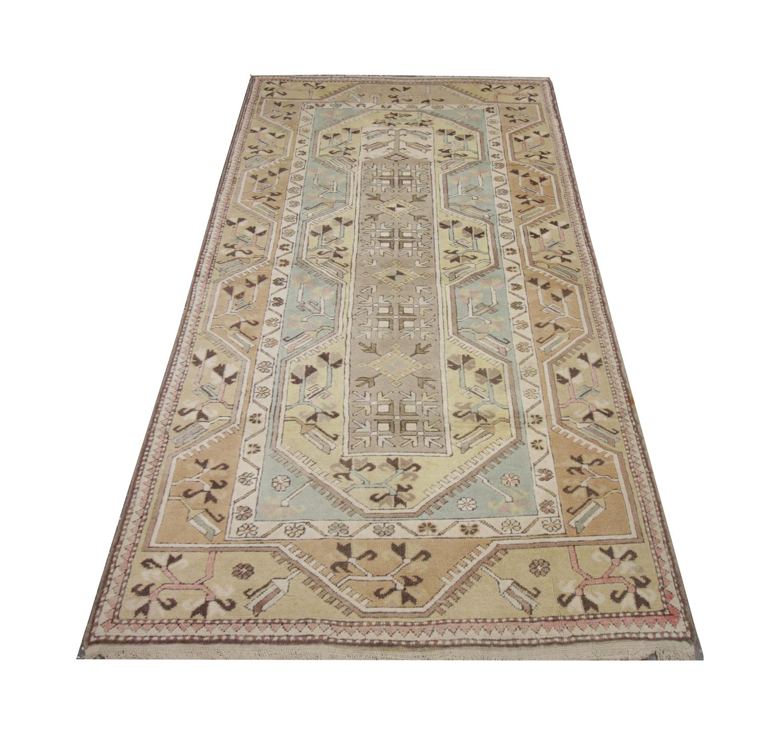 This fine wool rug is an excellent example of antique rugs from the 1900s. The central design features a deep blue background with tribal motifs woven throughout in red, beige, green and blue.
Both the tribal design and bold colour palette make this