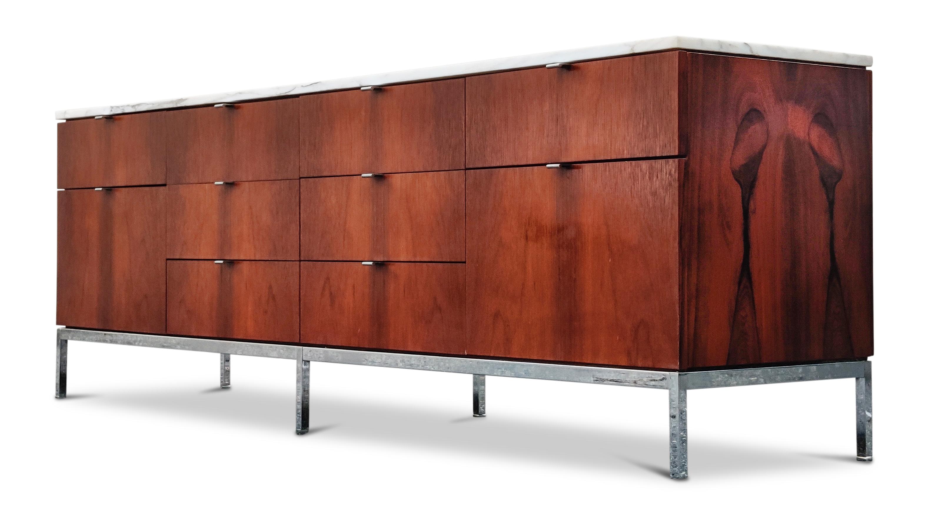 Vintage, made in 1972, rosewood credenza with original white Calacatta gold marble top on chromed steel legs with chromed pulls. Recently wax-burnished by hand, the rosewood color and pattern are very expressive and warm. No key for original lock.