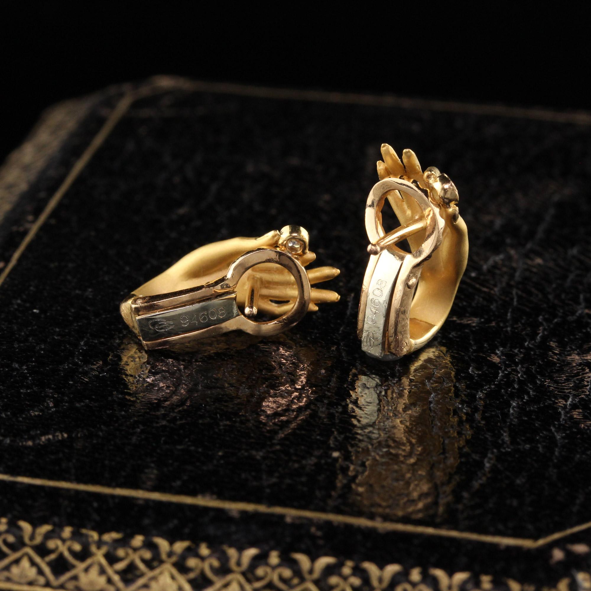 gold hand earrings