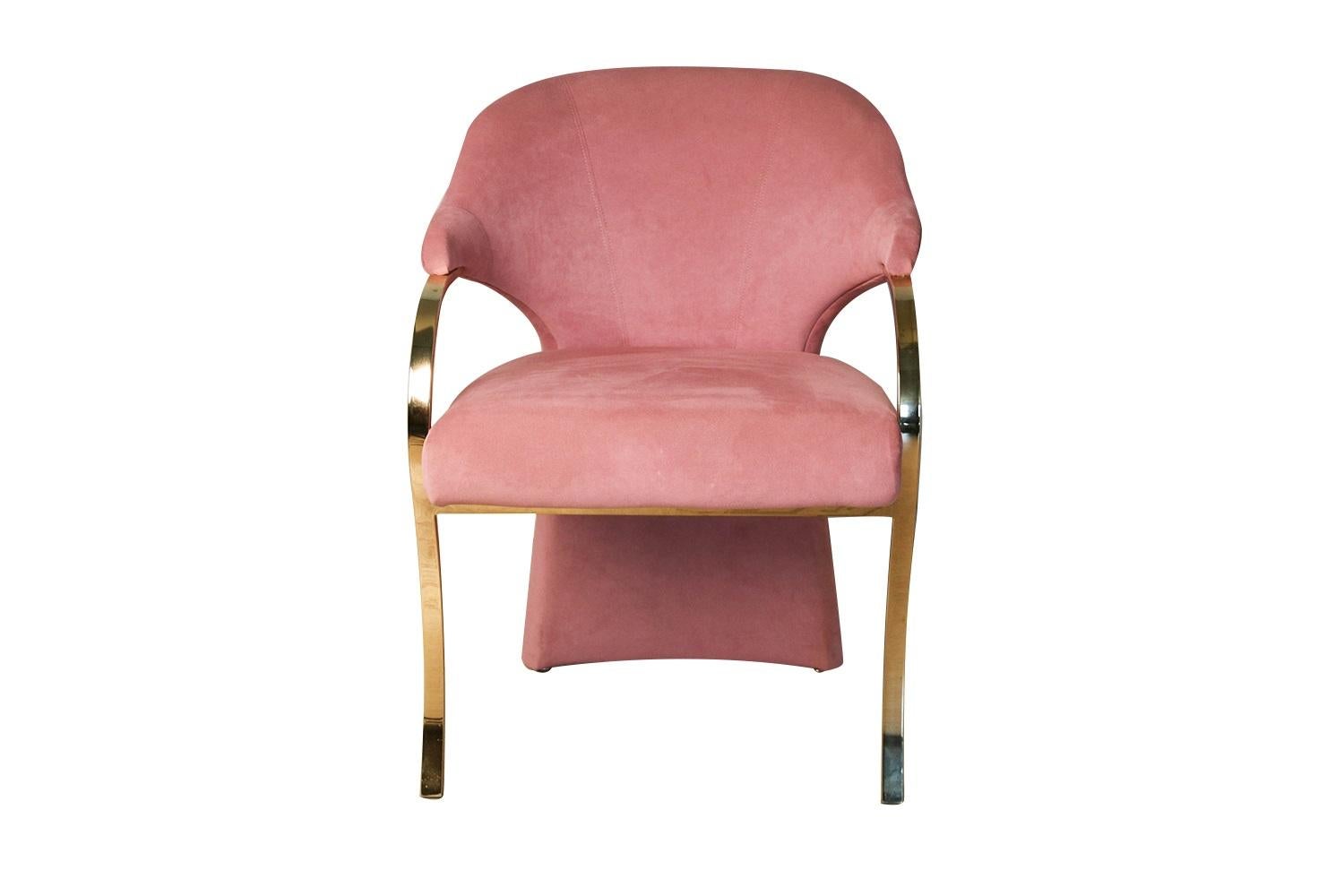 Vintage Hollywood Regency upholstered Carson’s armchair in great modern form, featuring a brass cantilever frame with a barrel backrest. Detailed raised soft padded seat cushion in original lush rose upholstery, and continuous arm to leg design with