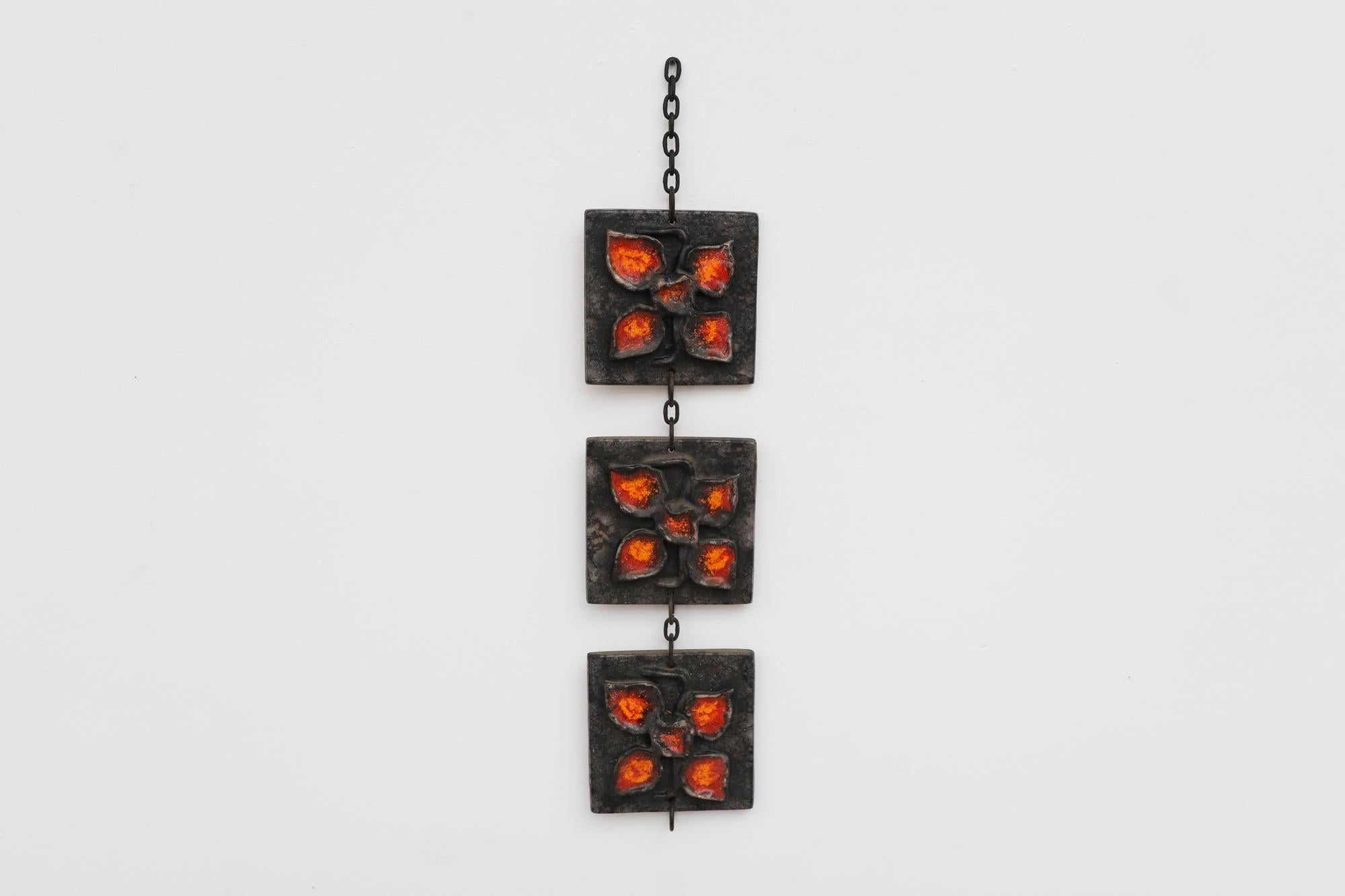 Vintage 1970's Carstens Tönnieshof Atelier West German ceramic wall plaque with 3 heavy sculptural ceramic tiles linked by thick blackened steel chain. Originally found hanging in gardens, sun rooms and kitchens to introduce fun pops of color. In