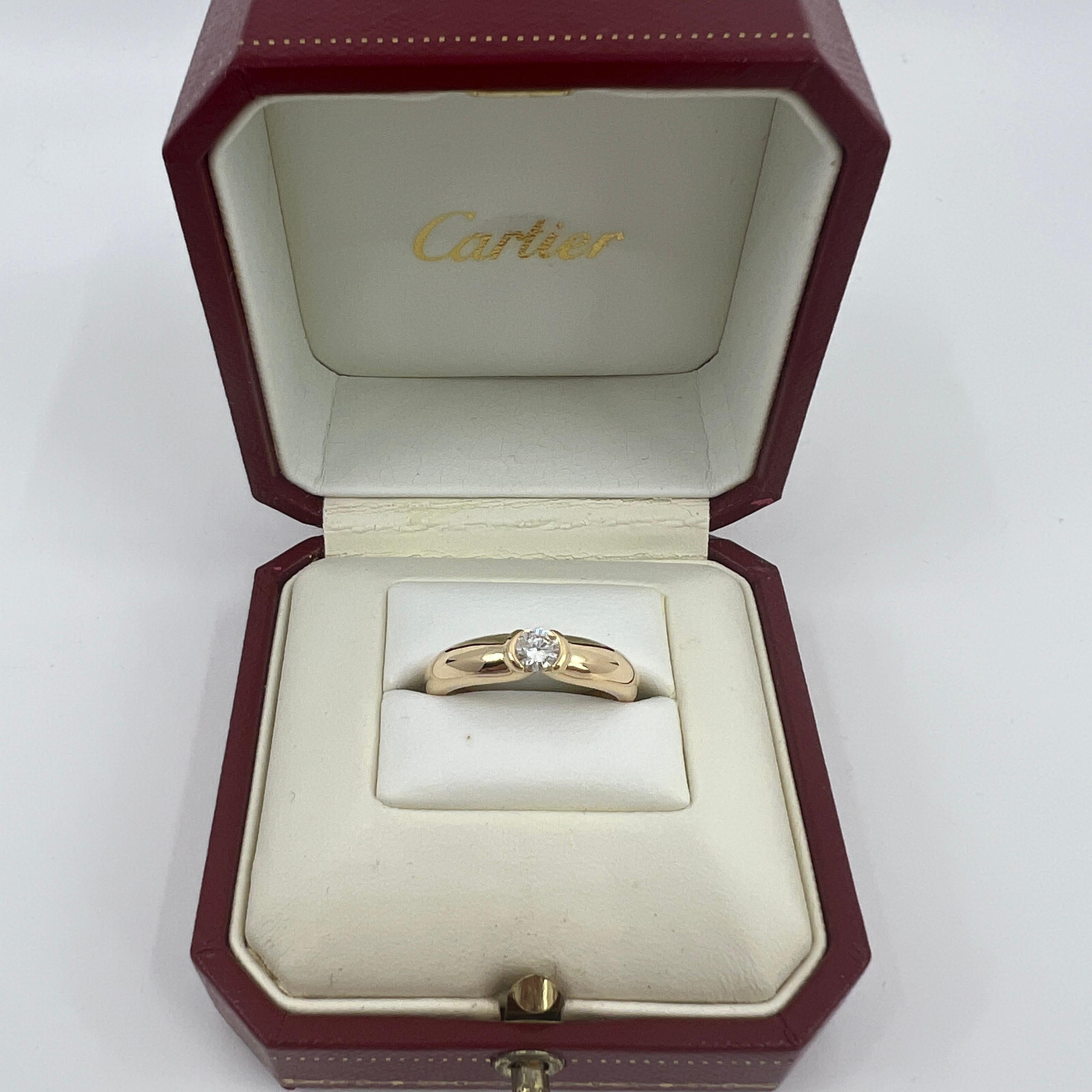 Vintage Cartier Runder Brillant Diamant 18k Gelbgold Solitär Ring.

Atemberaubender Ring aus Gelbgold, besetzt mit einem feinen runden Diamanten von 0.30 Karat. Farbe E, Reinheit VVS1, ausgezeichneter runder Brillantschliff. Edle Schmuckhäuser wie
