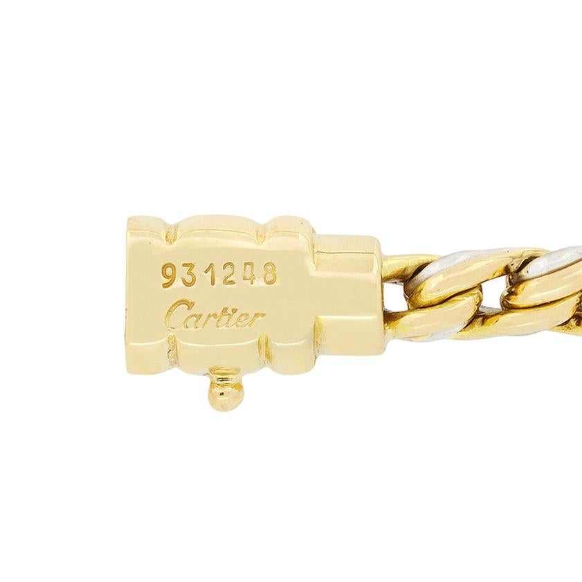 This fabulous vintage Cartier chain necklace is crafted in twisted 18 carat yellow gold and stainless steel chain, with a rectangular pendant sat central. The pendant features four round brilliant diamonds top and bottom with an additional two