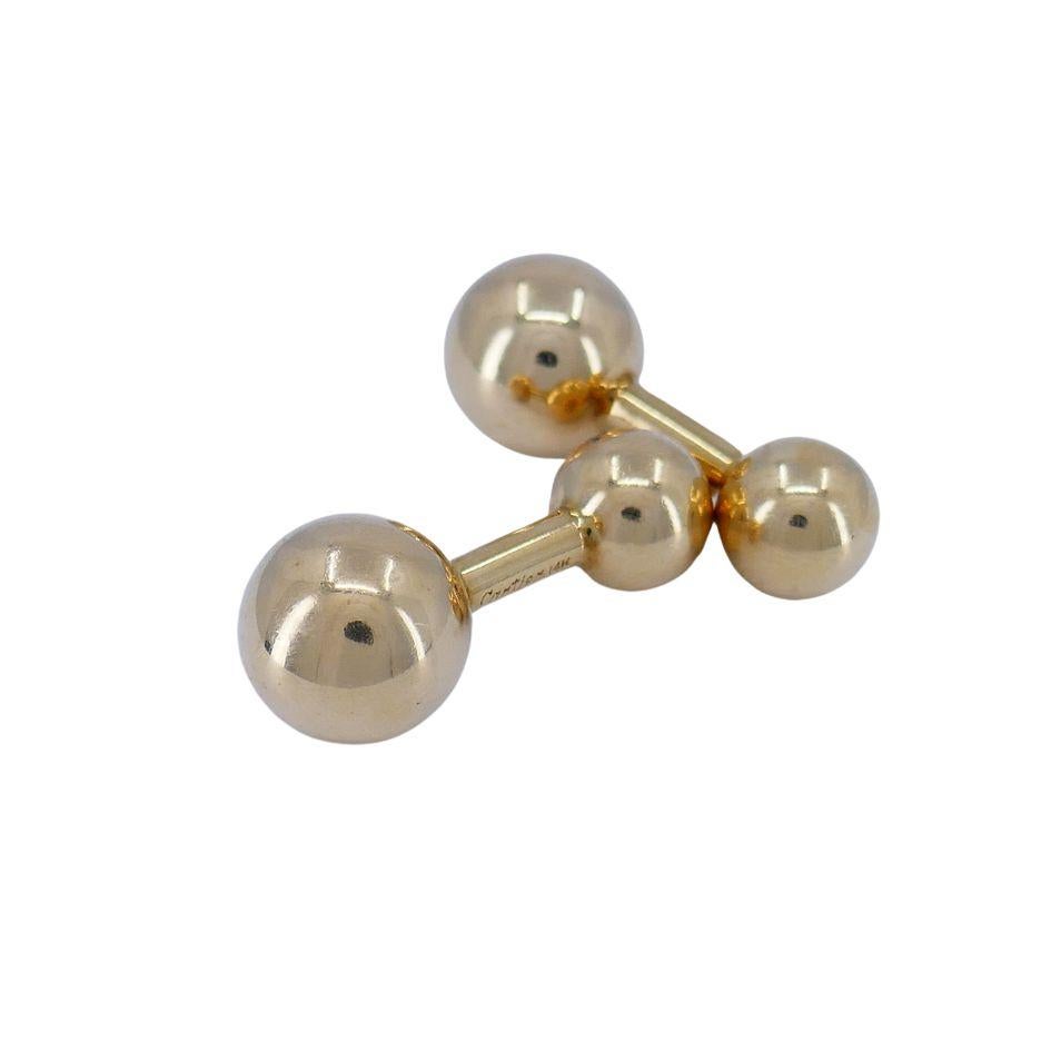 Boutons de manchette Vintage Cartier 14k Gold Barbell
Signé 'Cartier 14k'.
L'usure est conforme à l'état d'origine. 
9 grammes