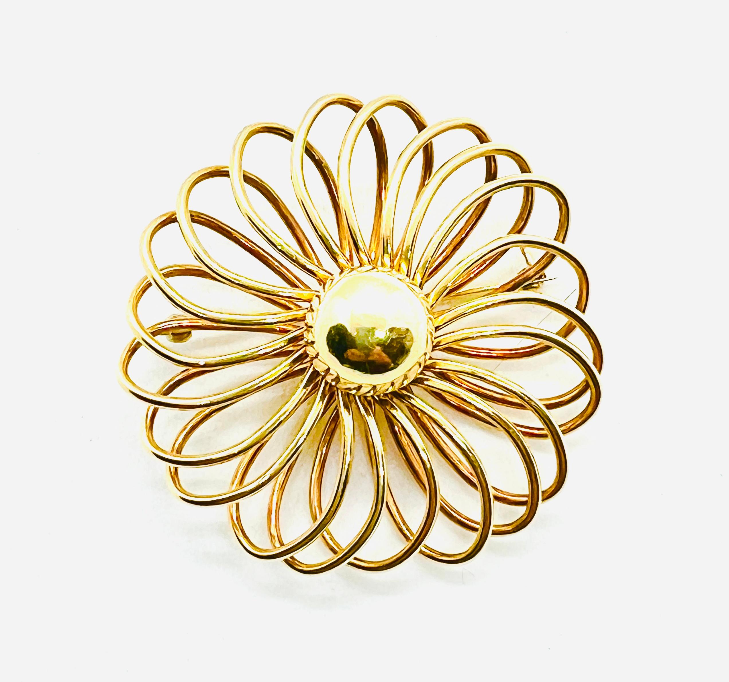 Gorgeous Vintage Cartier Spiral Design Brooch. Made in 14k Yellow Gold it measures 53mm in diameter and weighs 22.8 grams. This floral inspired piece is lovely and very easy to wear. Stamped 