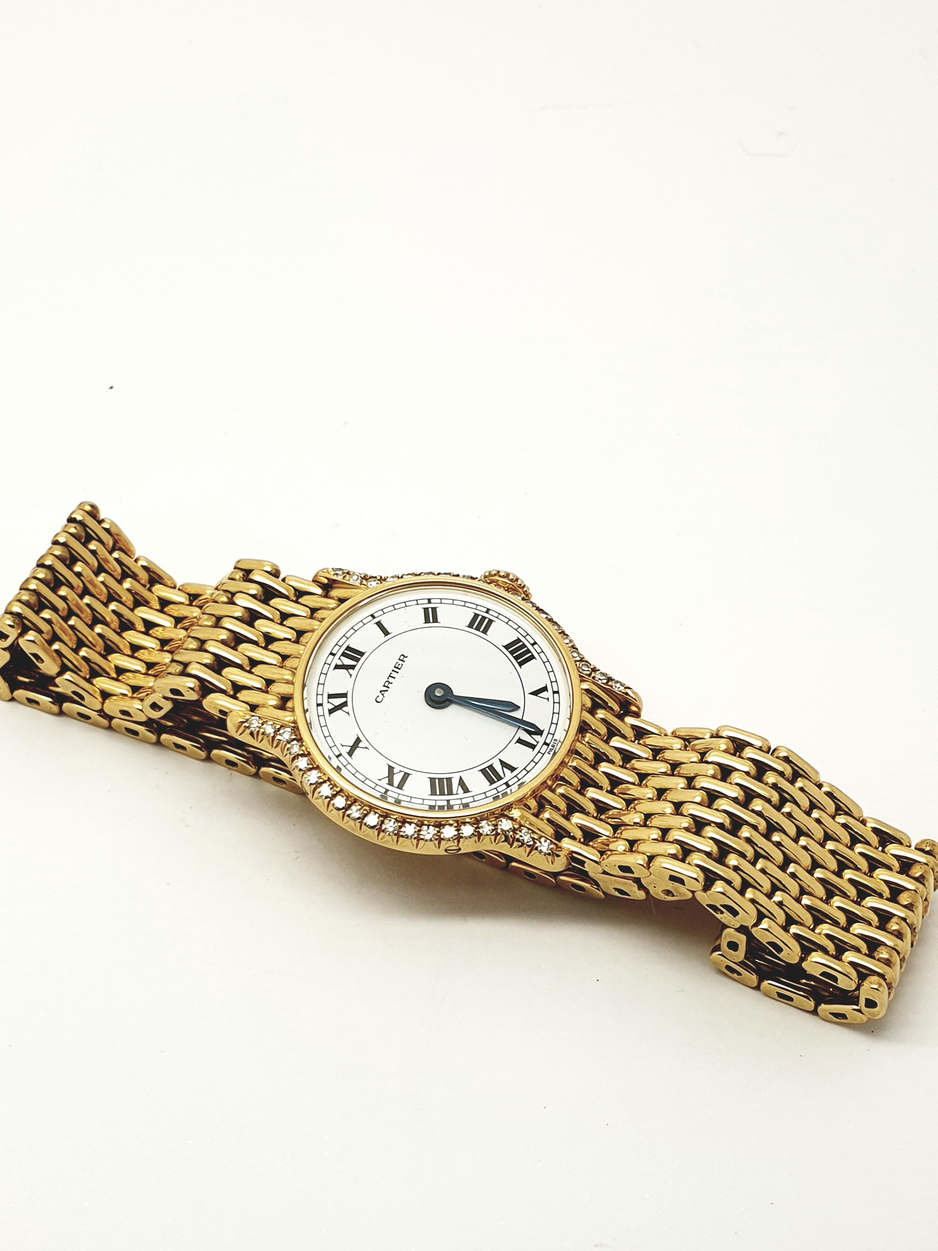 Offering this beautiful petite Cartier watch . It is in excellent condition . The case  diameter is 26 mm, set with small high quality diamonds. The dial  has the traditional Cartier black roman numerals. The 18 ct yellow gold bracelet is attached