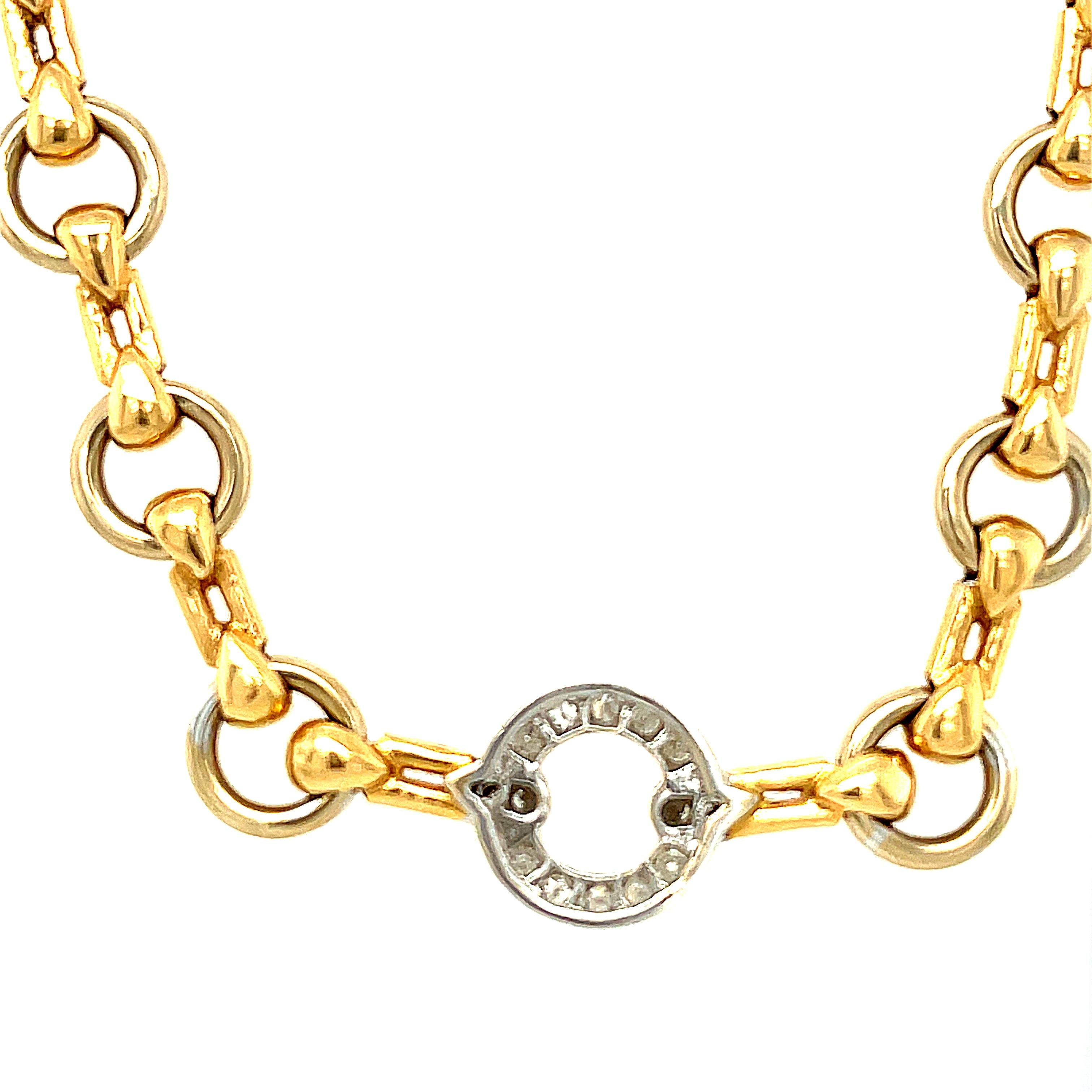 An attractive vintage circular link necklace with one diamond link by Cartier circa 1980. This open circular link necklace is made with Cartier’s attention to detail with a great hidden clasp. One sing diamond donut link accents the piece which can
