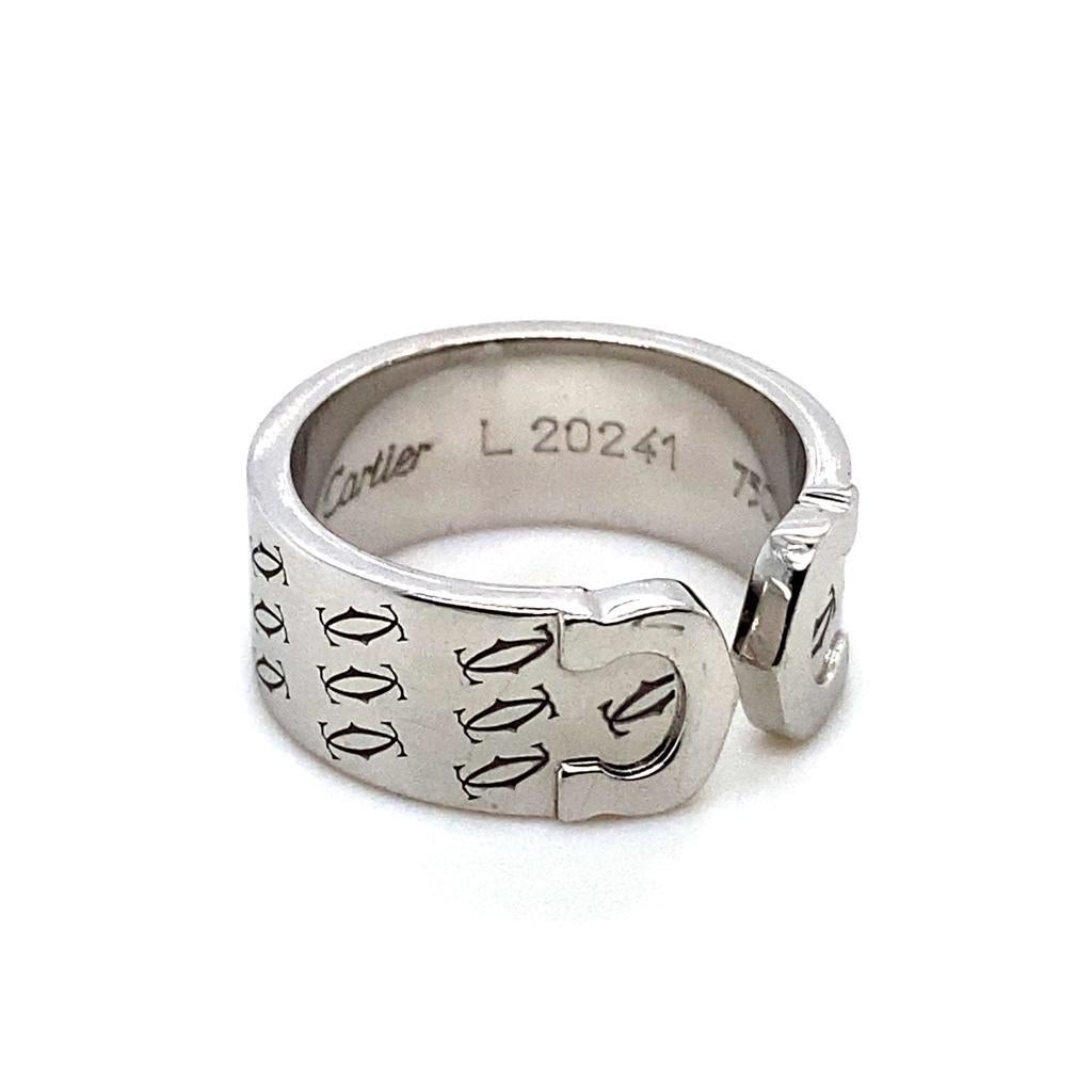 A Vintage Cartier 18 Karat White Gold Double C Logo Ring, Circa 2000.

This rare and unusual piece from the iconic C de Cartier collection, features the instantly recognizable double C and has a polished inner finish which is decorated with smaller