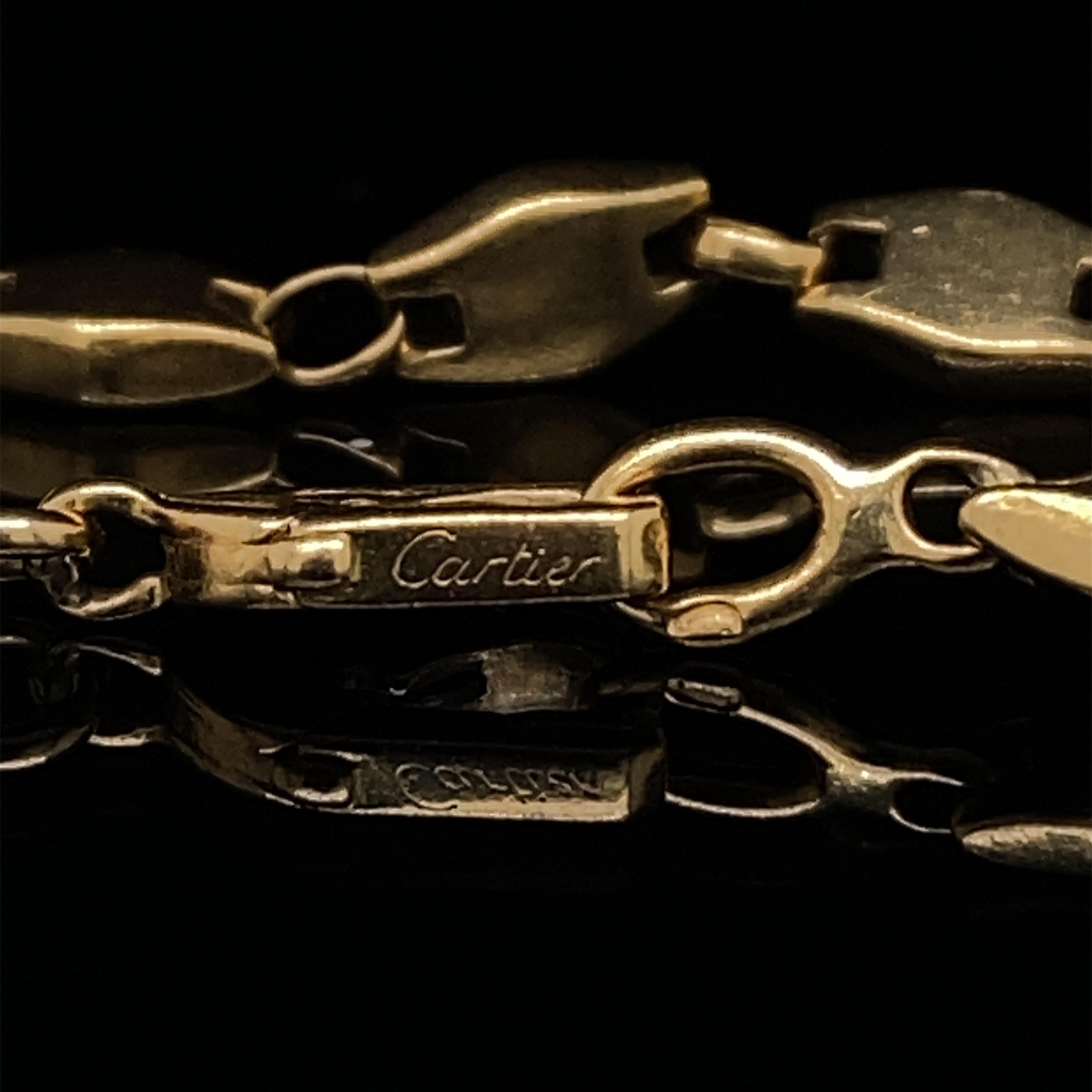 A vintage Cartier 18 karat yellow gold bracelet, circa 1980.

A beautifully wearable, comfortable vintage bracelet by Cartier; each flat lozenge shaped section is linked by a small elegant polished hoop. 

This bracelet sits nicely on the wearers