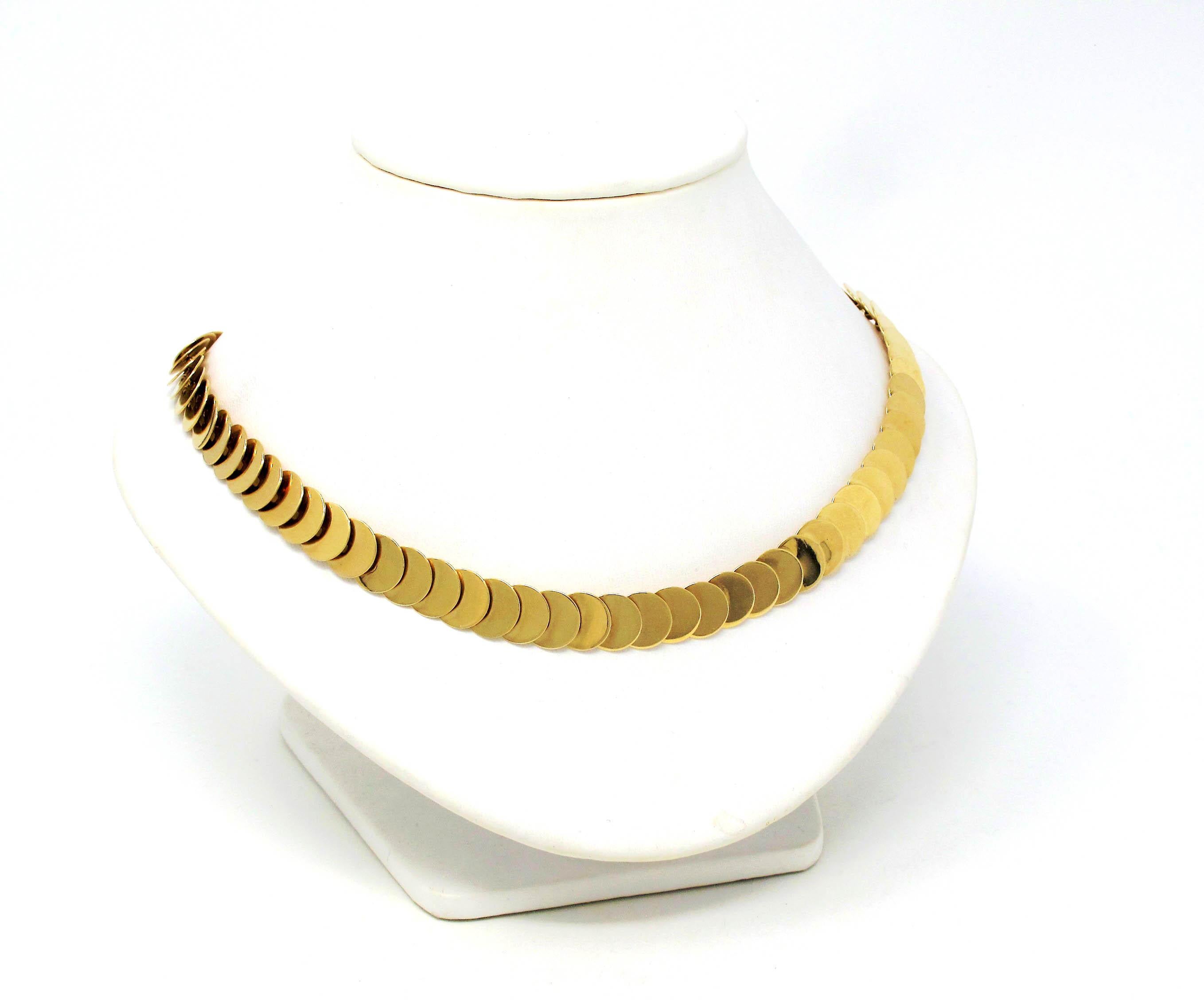 You simply cannot go wrong with this vintage designer piece from renowned jeweler, Cartier. This incredible solid gold disc necklace will elevate any look with its timeless design and versatile style. Can be worn alone or layered with other pieces
