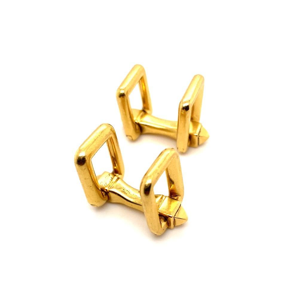 A vintage pair of Cartier 18 karat yellow gold folding cufflinks, circa 1960.

The solid and secure polished yellow gold folding fittings makes these cufflinks very easy to put on and wear and therefore an excellent every day item, bringing a hint