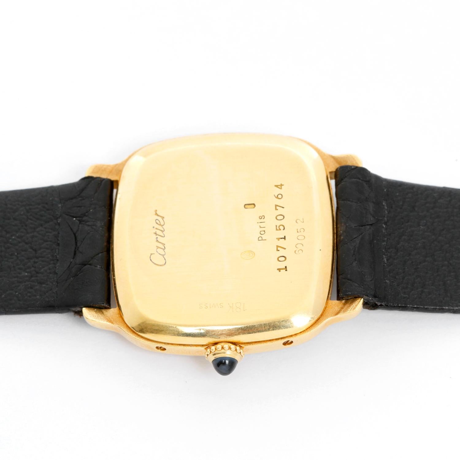 Vintage Cartier 18K Yellow Gold Unisex Watch  - Manual winding . 18k yellow gold case with sapphire cabachon crown (26 x 30 mm ) . White dial with black Roman numerals. Black Alligator Strap with Tang Buckle. Pre-owned, ca. 1940's/50's with custom