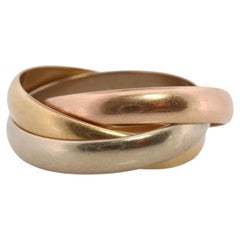Cartier 18k 750 Tricolor Rolle d'epoca. Anello triplo Must de Cartier. Banda
