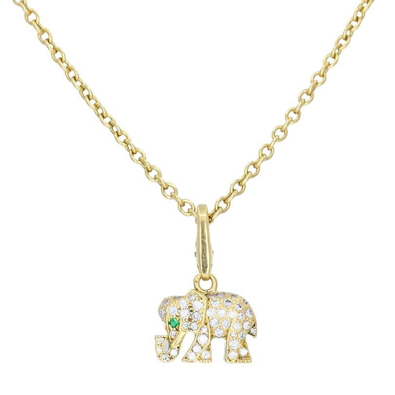 This vintage Cartier elephant pendant necklace is a charming and detailed piece, crafted from 18k gold. The pendant, shaped like an elephant, is encrusted with sparkling diamonds that add a touch of brilliance to its design, while a single emerald