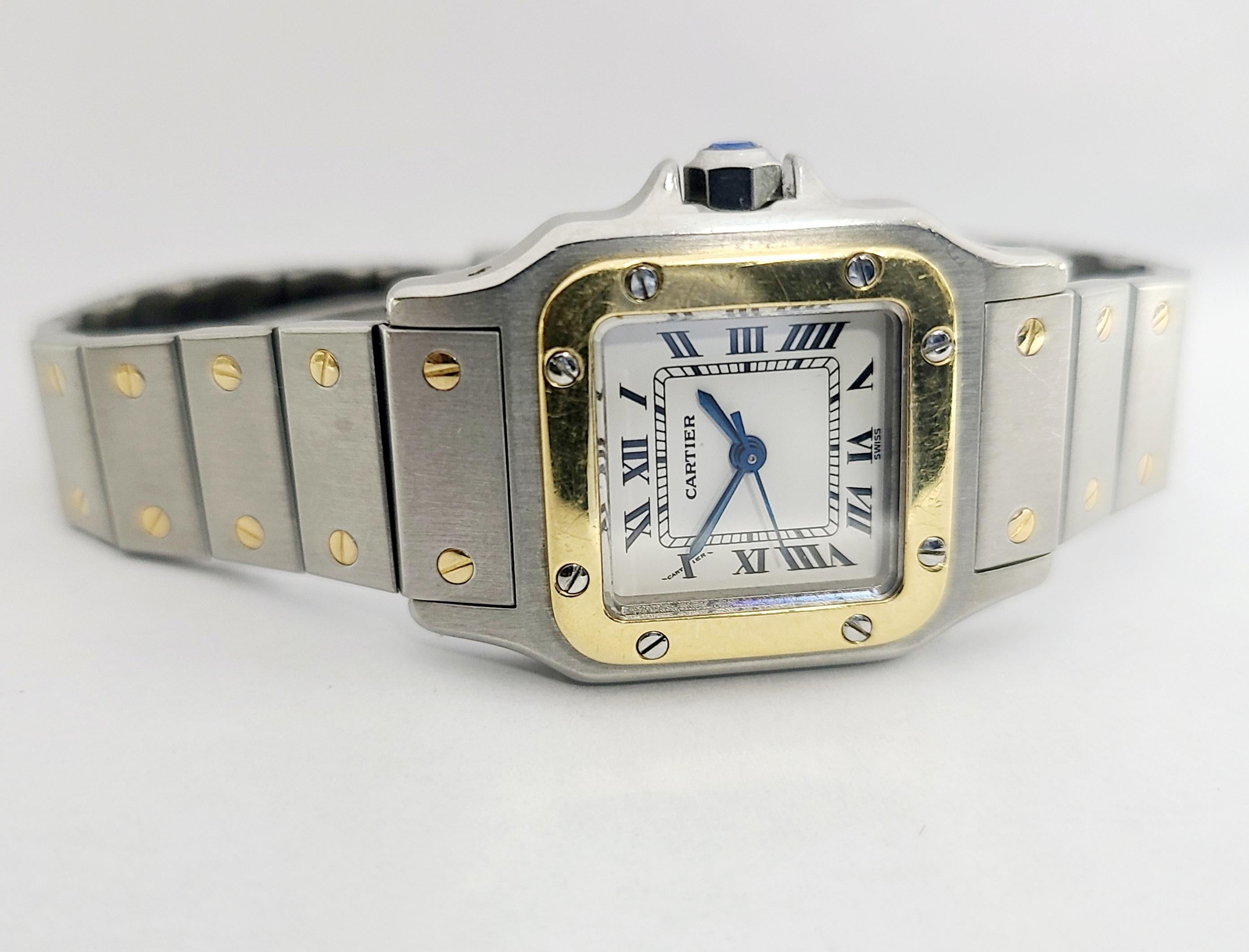 Vintage Cartier 18k Gold Steel Santos Automatic Ladies Watch 24mm.  Running strong and keeping great time.  This authentic Cartier automatique wristwatch is made from 18k yellow gold on the bezel and on the screws of the bracelet, and stainless