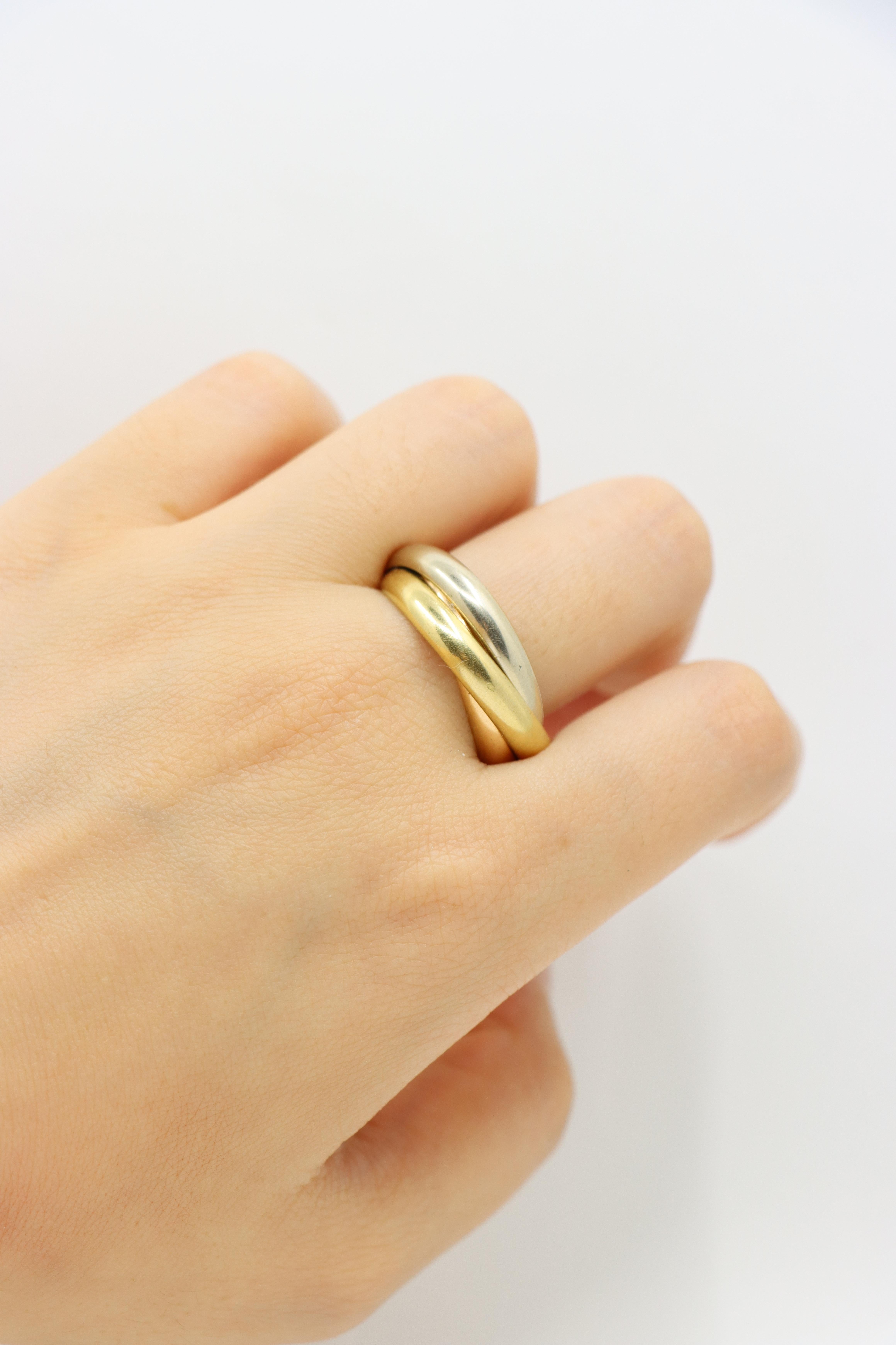 Vintage Cartier 18K Gold Trinity Ring

Marked:
750
Cartier

Approximate Dimensions: 
10 (Ring Size) 
0.8 cm (Width)
14 grams in weight.