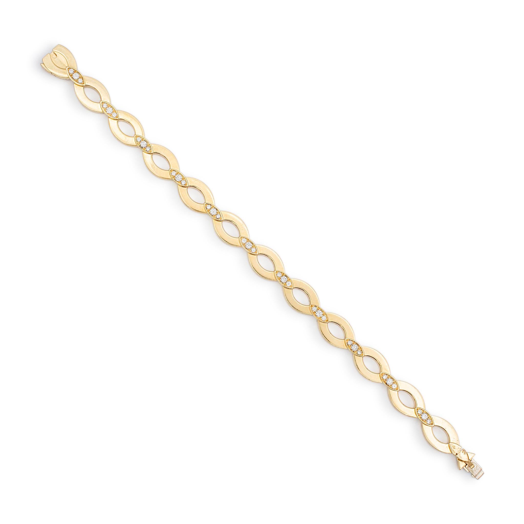 Brand: Cartier

Gender: Ladies

Metal Type: 18K Yellow Gold

Length: 6.50 inches

Width: 8.65 mm

Weight: 35.79 grams

Ladies designer made 18K yellow gold, diamond link bracelet. The metal was tested and determined to be 18K yellow gold. Engraved
