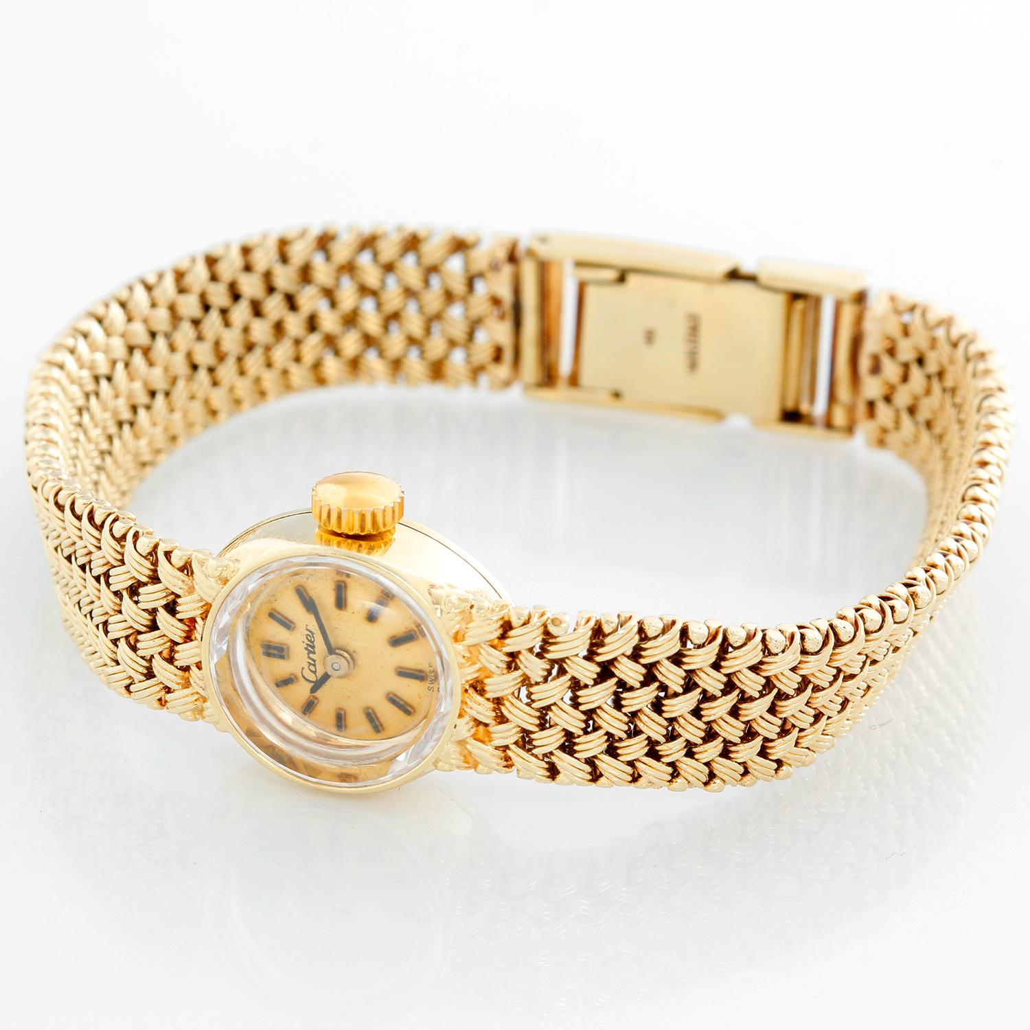 Vintage Cartier 18K Yellow Gold Ladies Watch - Mechanical. 18K Yellow gold case (15 mm ). Champagne dial with stick hour markers. 18K Yellow gold mesh bracelet; will fit a 6 1/2 inch wrist. Pre-owned with Cartier box .