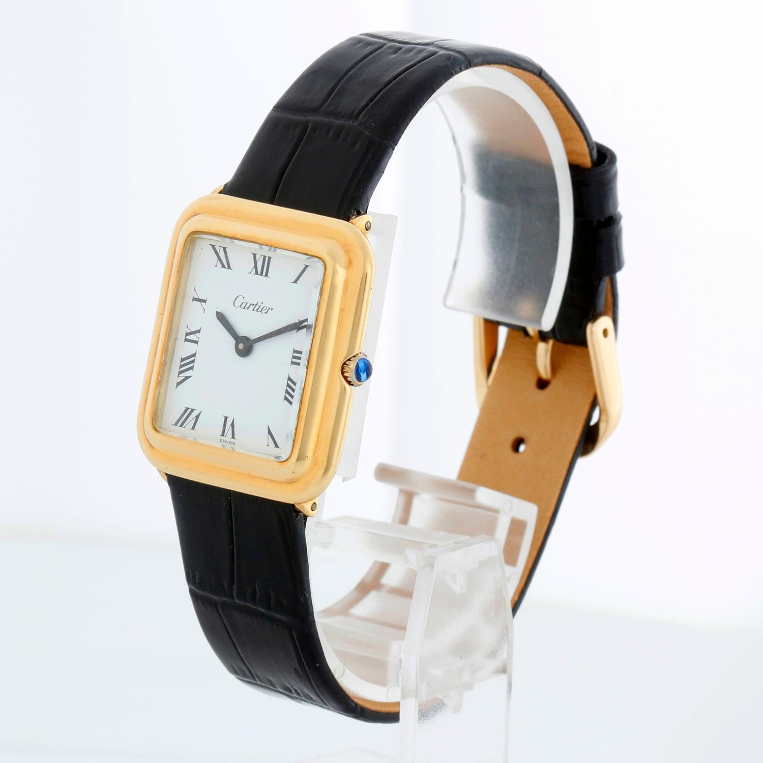 Vintage Cartier 18k Yellow Gold Stepped Ceinture Ladies Dress Watch - Manual wind. 18k gold case (26 x 28 mm). White dial with Roman numerals. Generic Black strap band with tang buckle. Pre-owned with custom box.

