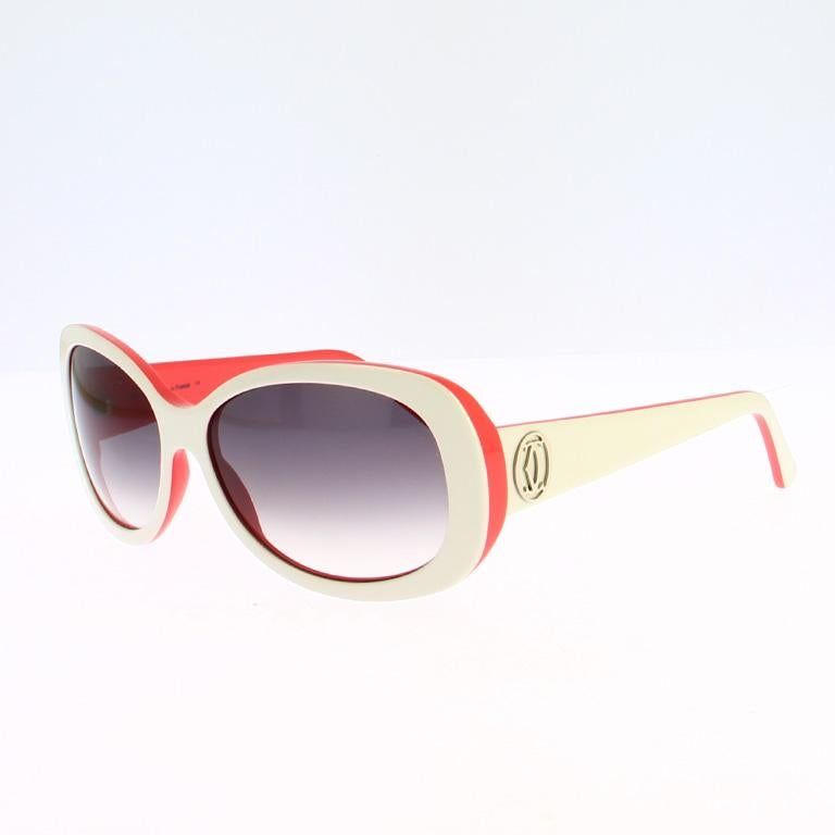 Experience the sophisticated allure of these vintage Cartier sunglasses — a true reflection of the Maison’s timeless elegance and mastery of design. Crafted from premium white acetate, this exquisite frame reveals a refined pink-red interior that