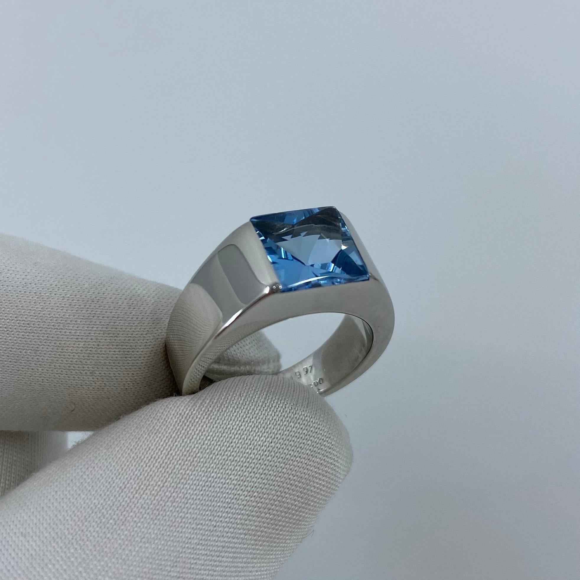 Cartier Blue Topaz 18 Karat White Gold Tank Ring.

Stunning white gold ring with a large 8mm tension set Swiss blue topaz. Fine jewellery houses like Cartier only use the finest of gemstones and this topaz is no exception. A top quality topaz with a
