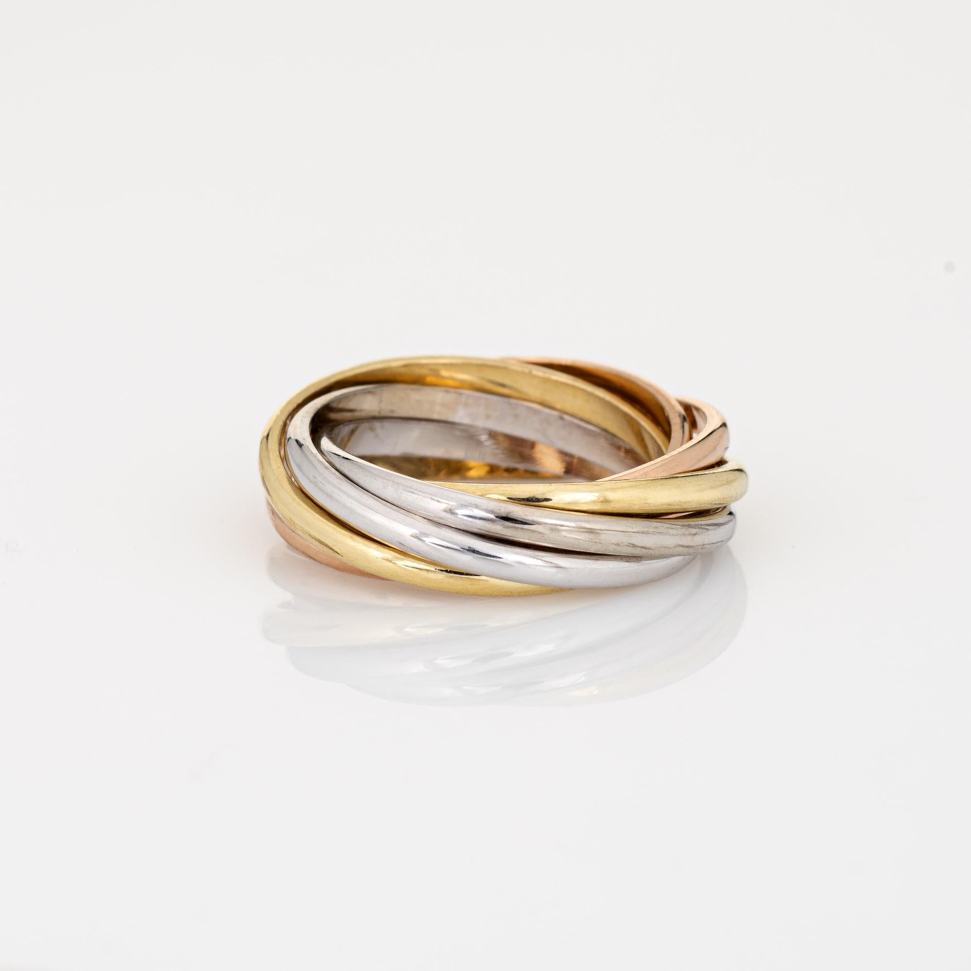 Vintage Cartier 7 band Trinity ring crafted in 18k yellow, white & rose gold.  

The Cartier ring features bands of 18k rose, yellow & white gold. Each band measures 1.5mm wide. The ring is great worn alone or layered with your fine jewelry from any