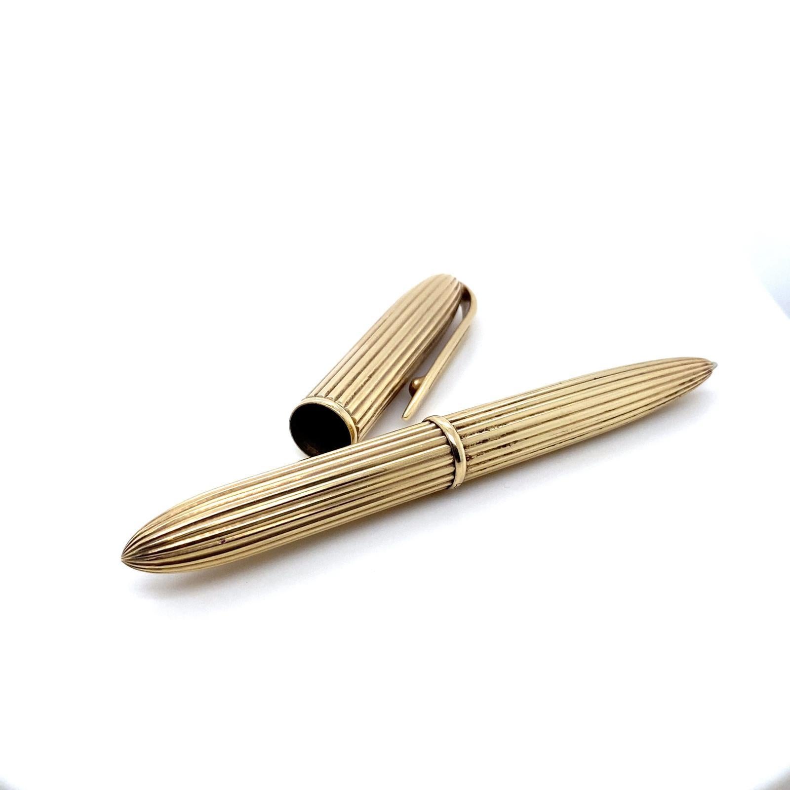 A vintage Cartier 9 carat yellow gold pen, circa 1970.

Designed in ridged yellow gold, with a gently rounded cap and barrel and tapered clip, this is a smart and elegant addition to an office or jacket pocket.

This pen from Cartier is every bit as