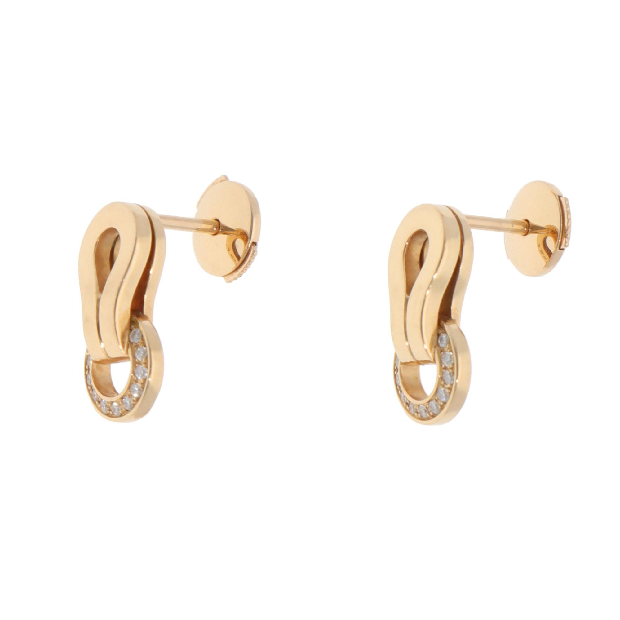 A beautiful pair of vintage Cartier Agrafe diamond stud earrings set in 18k yellow gold.

From the Cartier Agrafe collection, the earrings have a wonderful geometric hemstitched buckle partially paved with 22 round brilliant-cut diamonds. They are