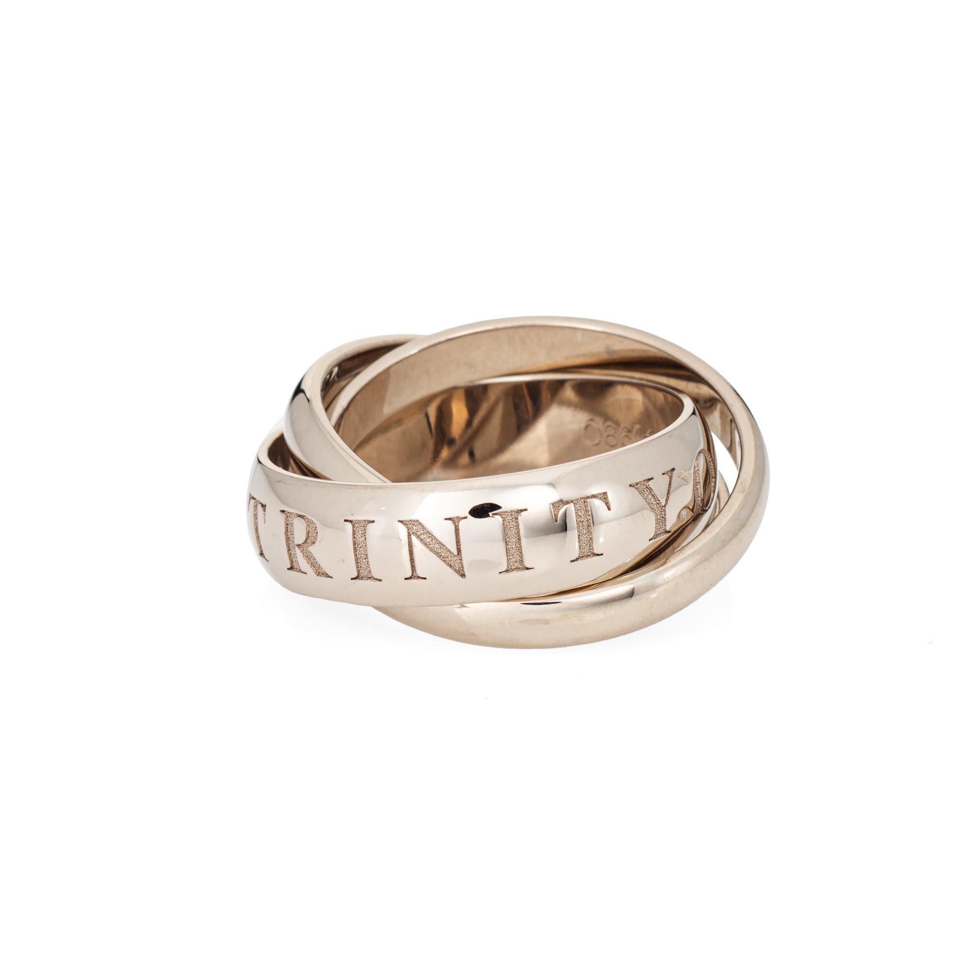 Cartier 'Amour et Trinity' ring, crafted in 18 karat white gold. 

The ring is circa 1998 and no longer available for sale at retail. The ring was a limited edition release for the holidays in 1998. Also included is Cartier service papers (the ring