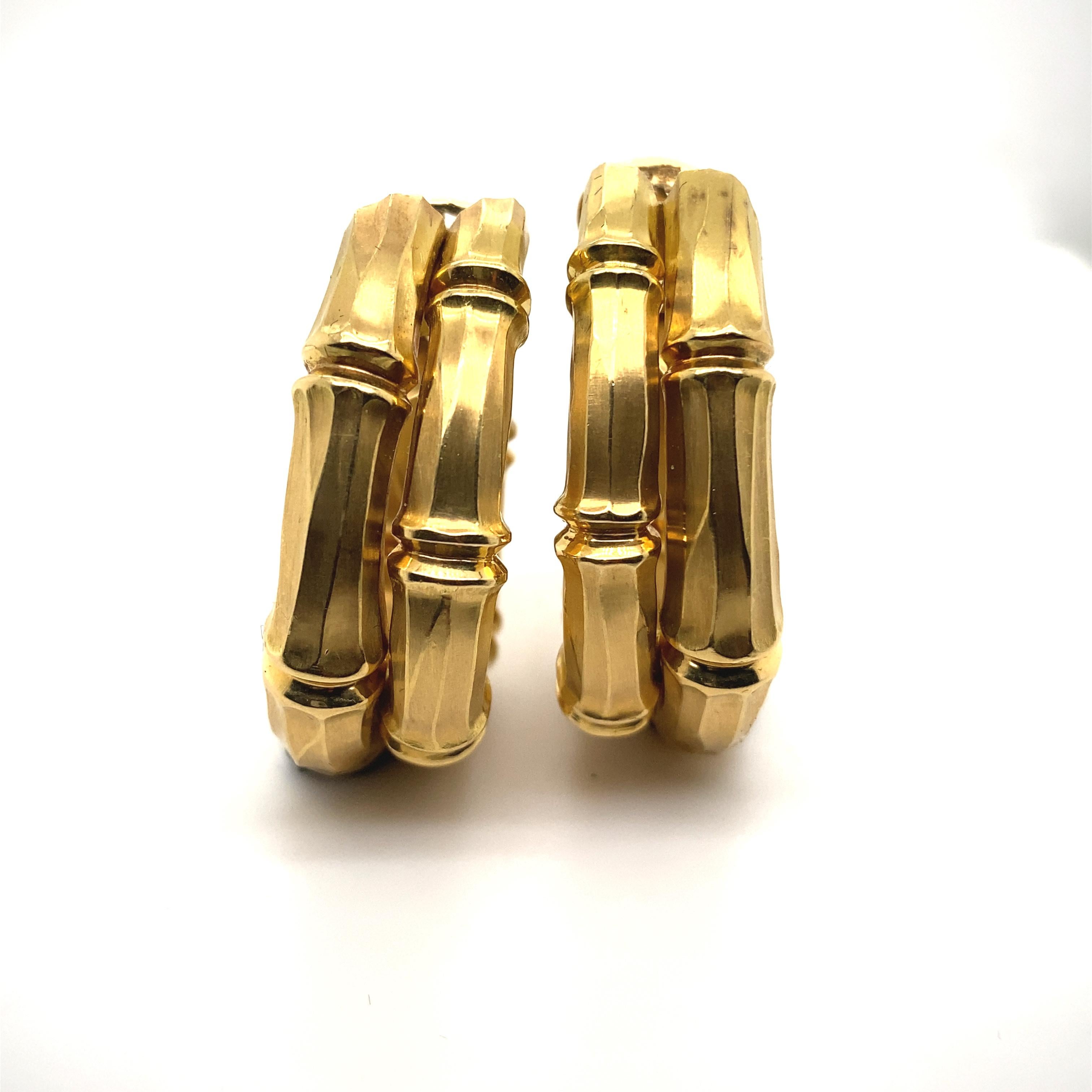 A vintage pair of Cartier Bamboo 18 karat yellow gold hoop earrings, circa 1990.

This bold pair of earrings were first designed by Cartier in the 1970's, the 'Bamboo' collection radiates with chic, easy going style.

Each earring depicting a double