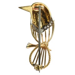Cartier Broche oiseau vintage en or 18 carats, rubis et diamants