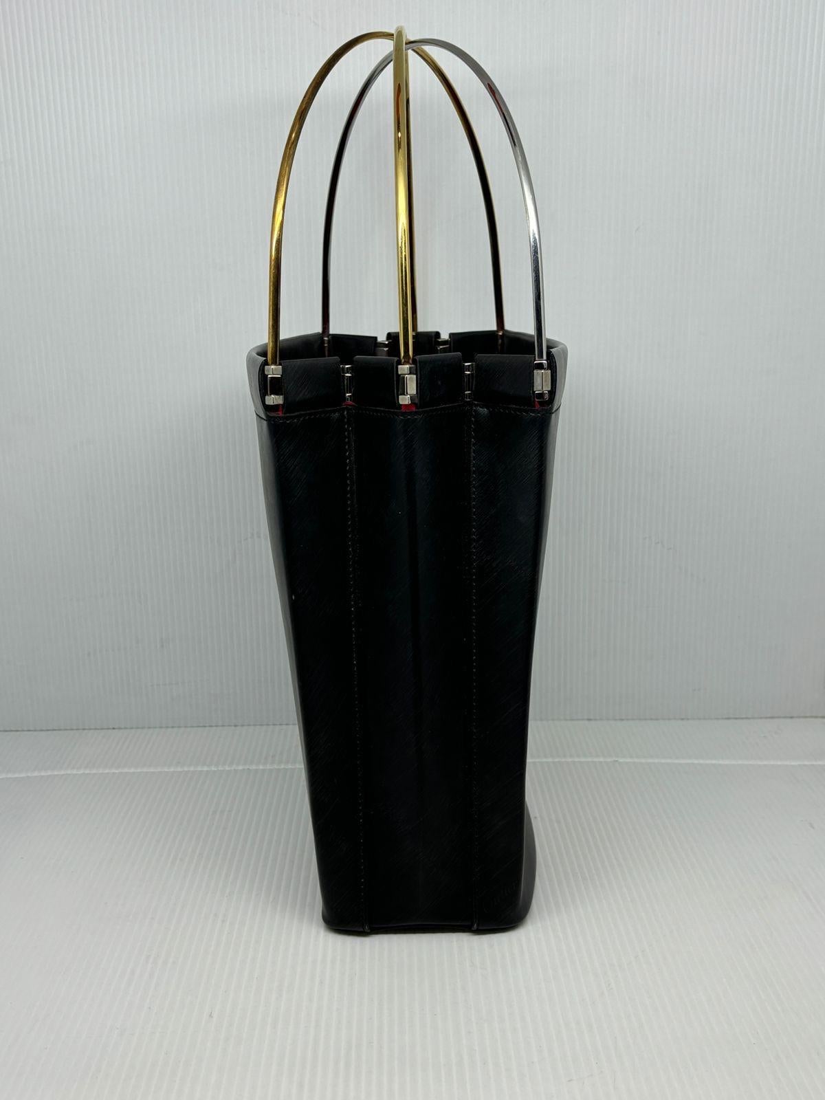 Vintage Cartier black trinity tote in small size. Perfect everyday bag size with compartments. Can be worn for formal occasions as well. Excellent vintage condition, no significant signs of wear at all. Minor scuffing on the corners.
