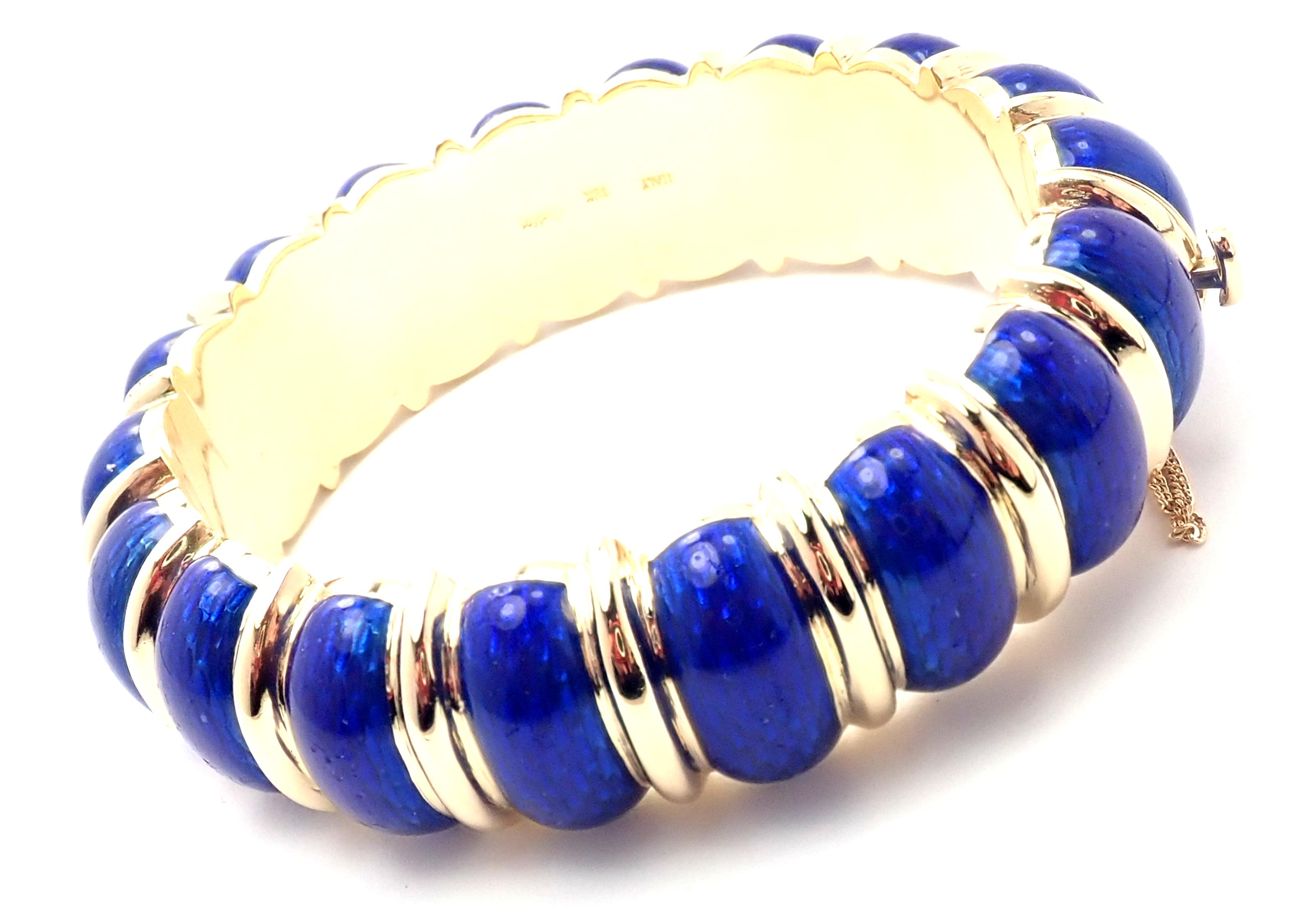 18k Yellow Gold Blue Enamel Wide Bangle Bracelet by Cartier. 
Details: 
Length: 7