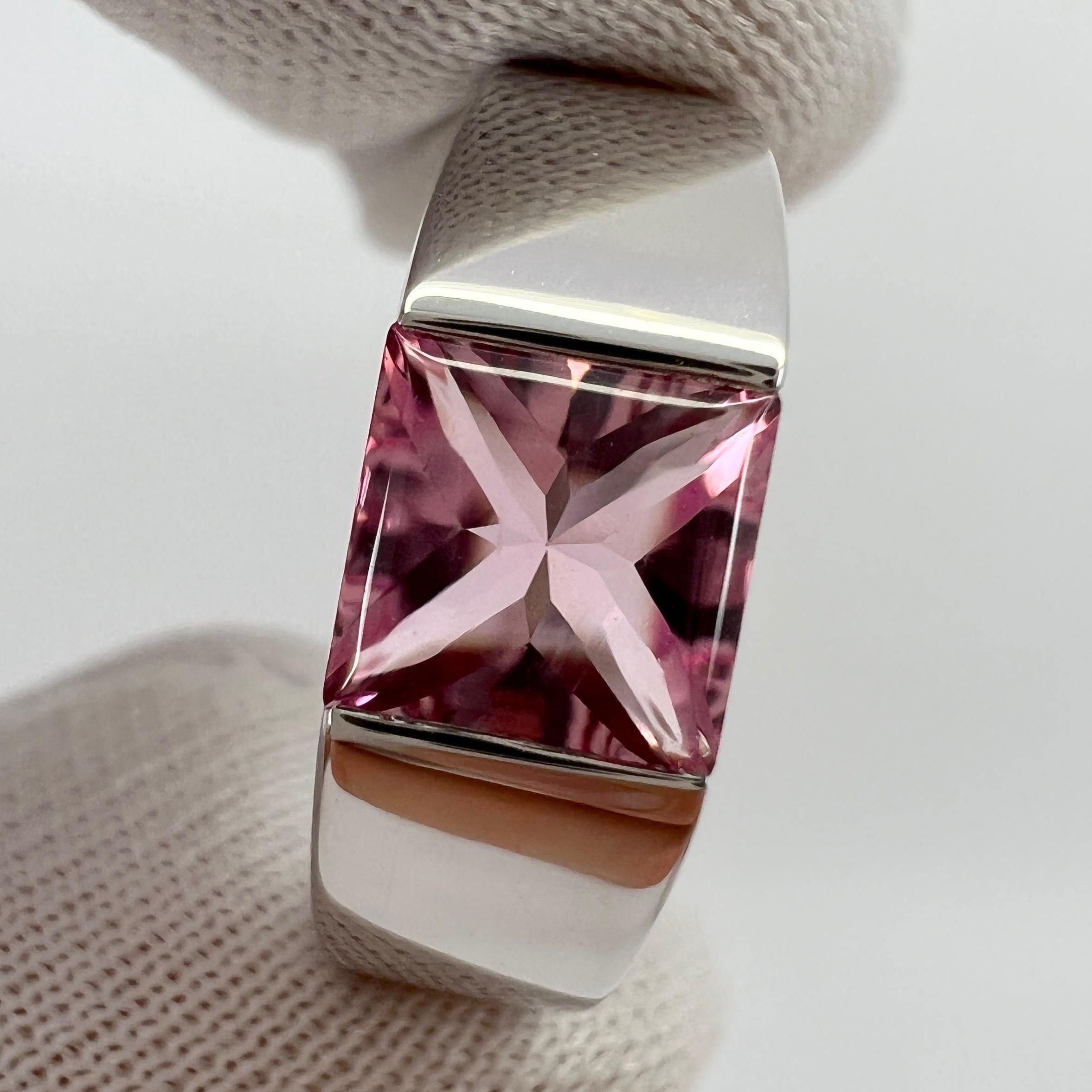 Vintage Cartier Pink Tourmaline 18 Karat White Gold Tank Ring.

Stunning white gold ring with a 6mm tension set bright pink fancy-cut tourmaline. Fine jewellery houses like Cartier only use the finest of gemstones and this tourmaline is no