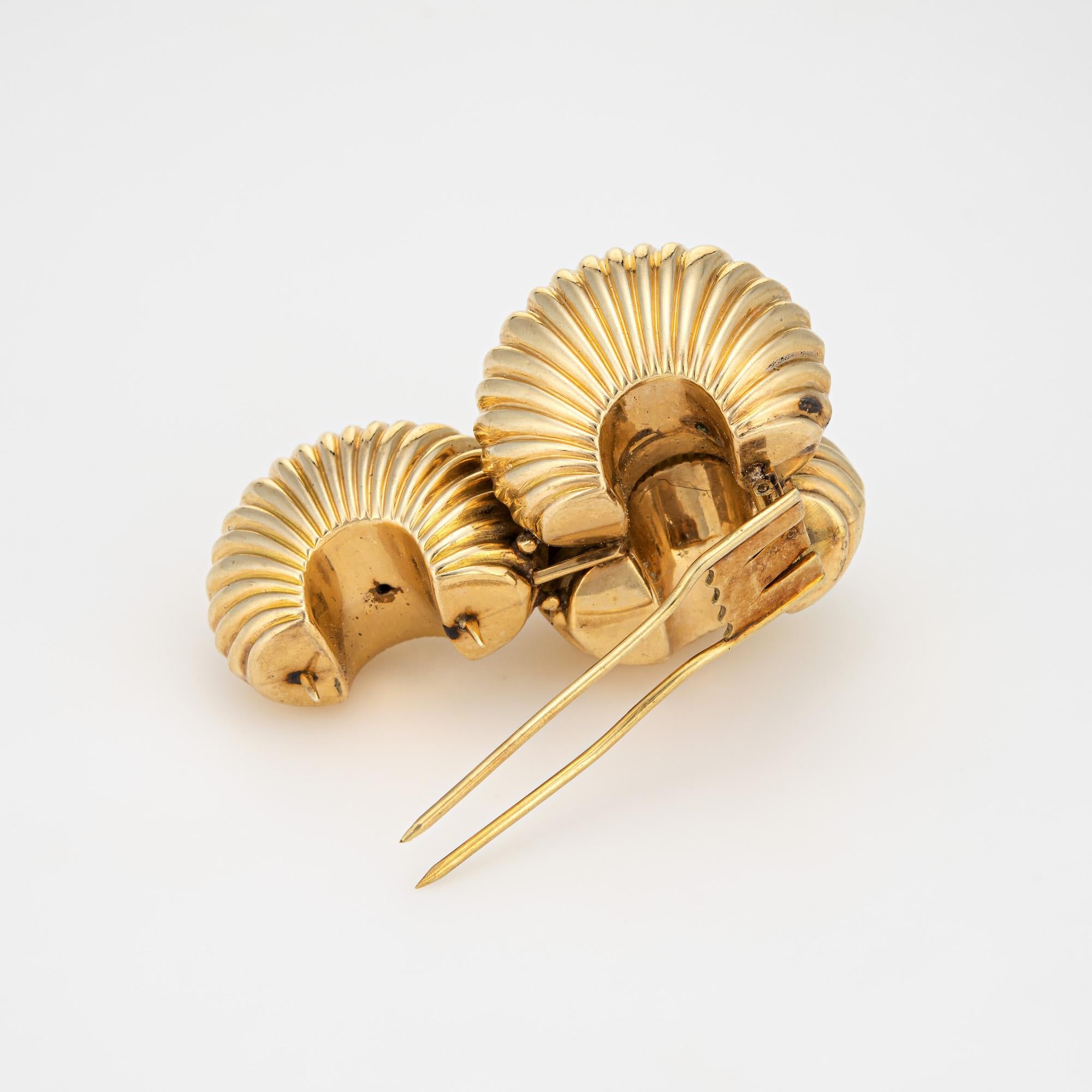 Finely detailed vintage Cartier brooch (circa 1945) crafted in 14 karat yellow gold. 

The stylish vintage brooch features 3 fluted high domes in a textured shell motif. The whimsical design of the brooch highlights the bold aesthetic of the retro