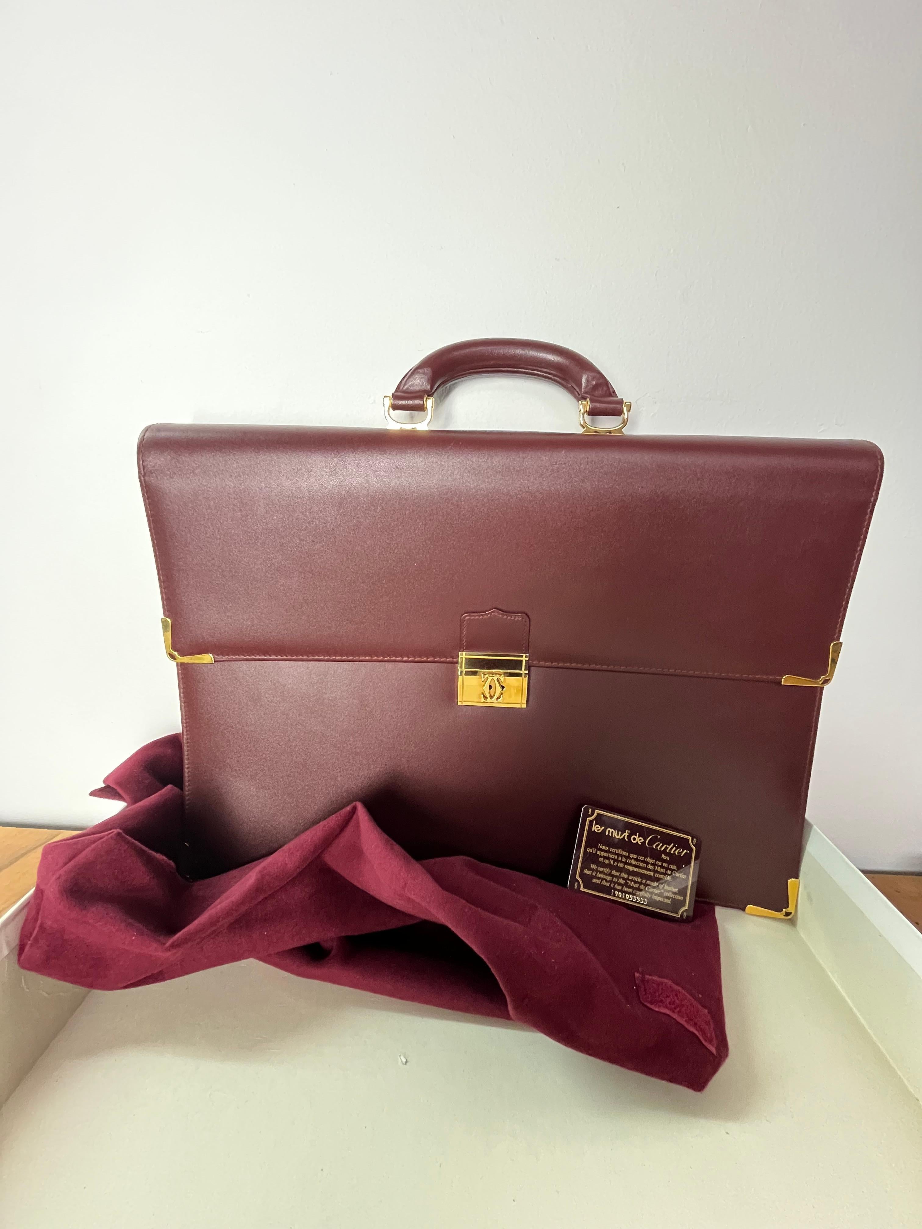 Vintage Cartier burgundy leather document holder, golden metal details, 42x30x9 cm, with dustbag, 1990s.
Good condition, used only once.