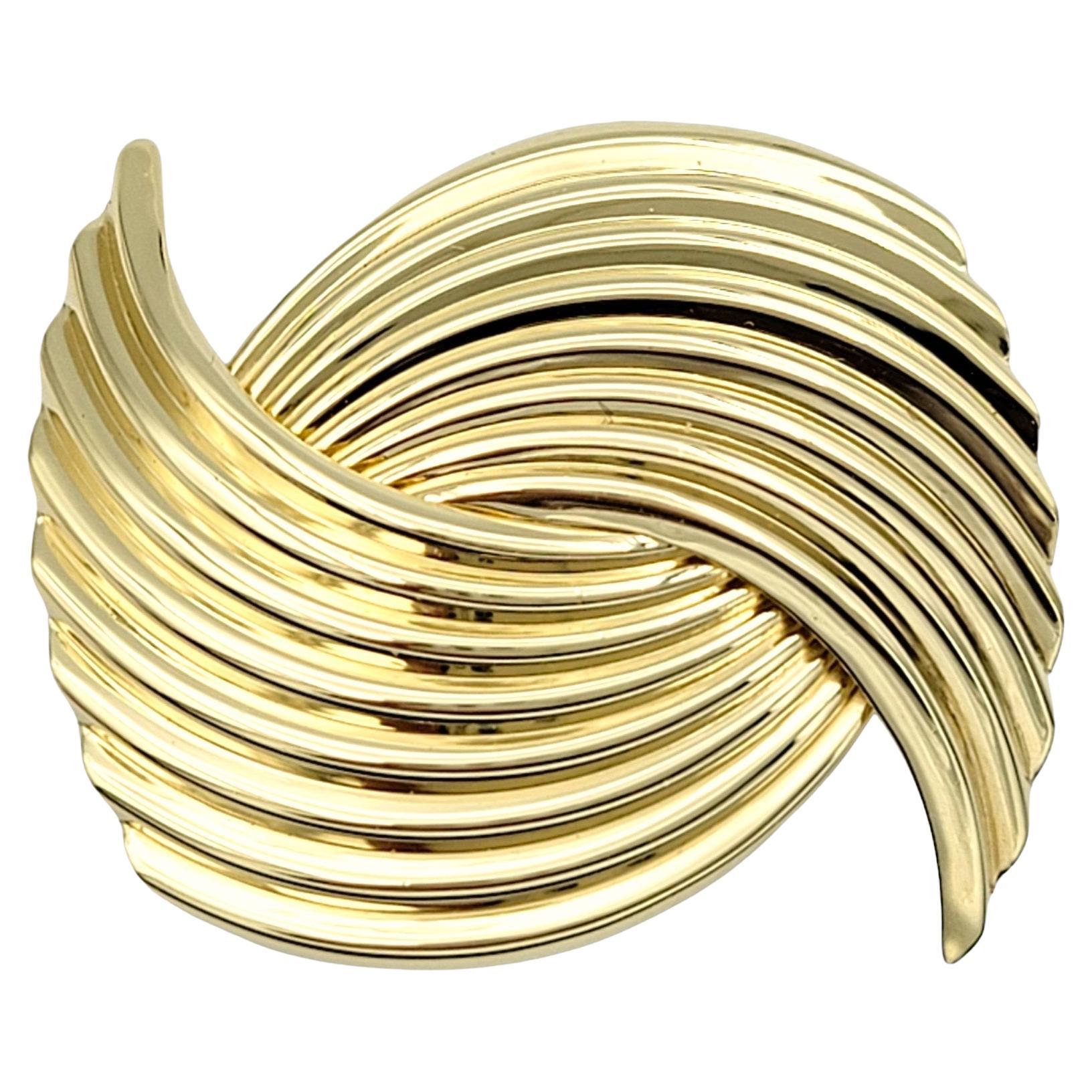 Vintage Cartier Bypass Design Ridged Brooch Set in Polished 14 Karat Yellow Gold For Sale
