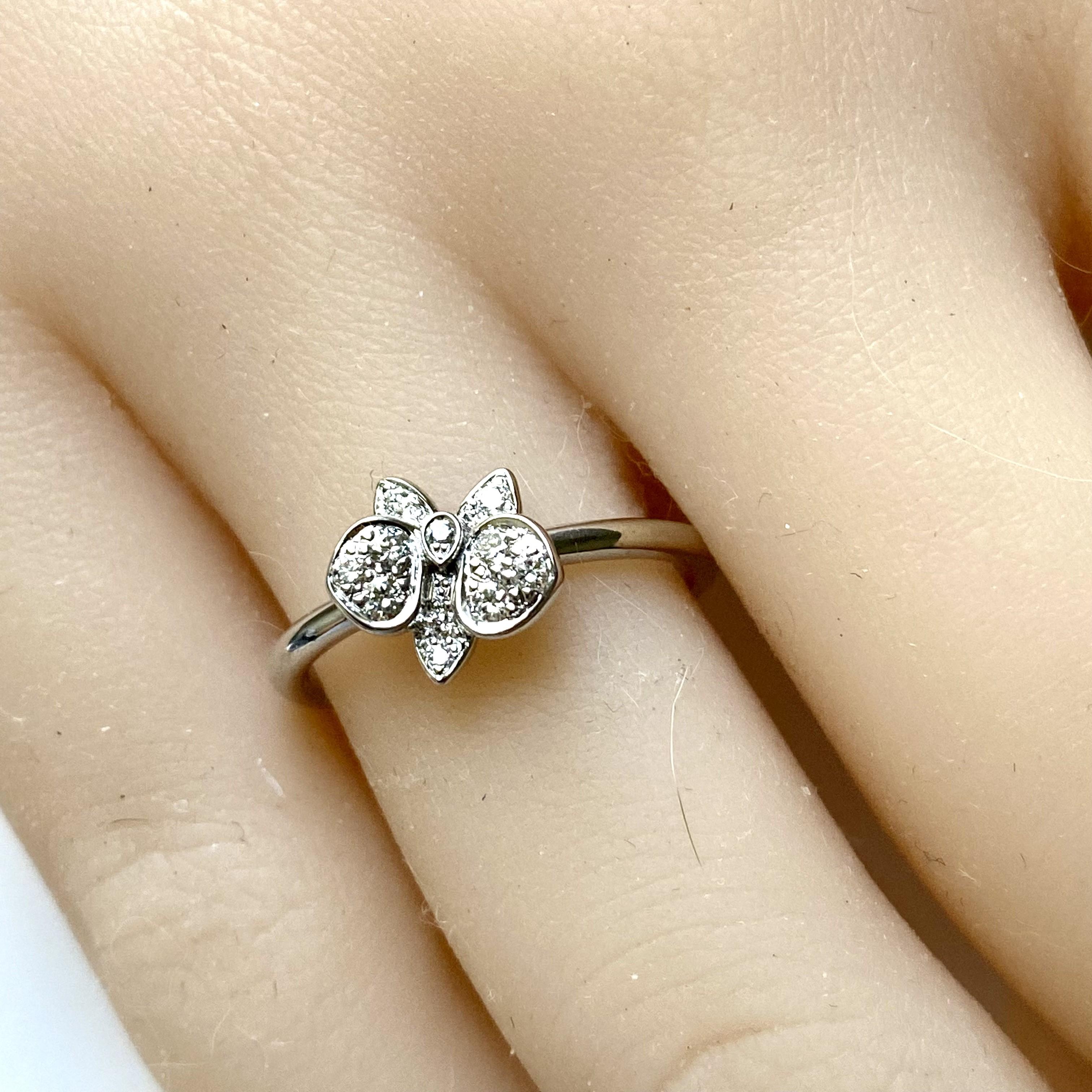 A Cartier favorite, the orchid is the key element of this delicate collection: discover Caresse d’Orchidées
Cartier Paris diamond orchid flower ring
18k white gold diamond ring 
Ring size: 6.5
Ring weight: 2.8 gram
Condition: A+: